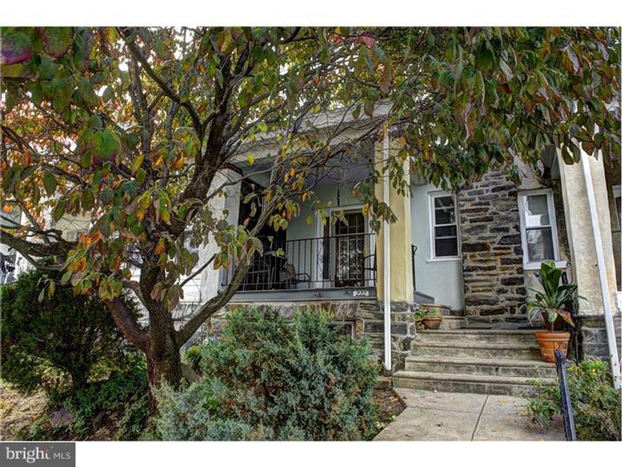 Fabulous updated townhouse! Enter from covered porch through new front storm door to living room with new ceilings, recessed lighting and hardwood flooring with inlay.  The formal dining room as ceiling fan, hardwood flooring and chair rail and crown molding.  Amazing kitchen with maple shaker cabinets, tiled backsplash, solid surface counters, and stainless appliances. Additionally, the kitchen has a mid-century wet bar with sink for serving. (Could be removed to make the kitchen eat-in) Second floor has three bedrooms and a large hall bath with both tub and stall shower.  Basement is walk out with laundry area, storage and walk out through new back door to one car garage. House has been rewired with 100 amp service.  Newer windows. In October 2014 installed NEW rubber roof to entire flat main roof and entire front porch roof with 10 year transferable leakage guarantee.   Move in ready. This home is very convenient to transportation....easy ride to downtown Philadelphia (Note- Powder room in basement has not been used for a very long time, and seller believes it needs some repair)