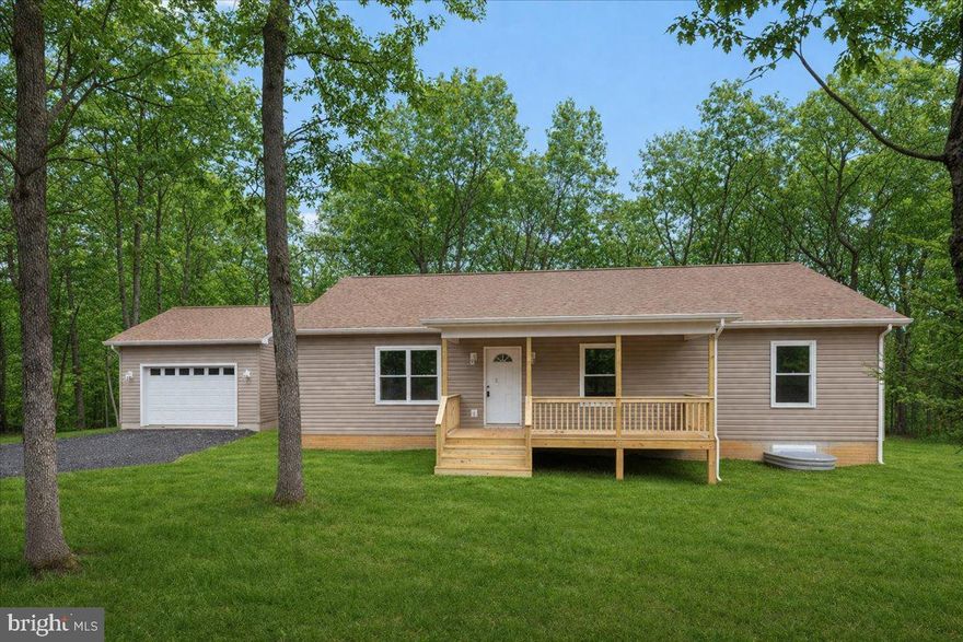 Welcome Home to Your Peaceful Woodland Retreat!  In Drywall

Imagine coming home to over 3 acres of privacy, surrounded by trees, fresh air, and the quiet beauty of nature. Ideally located in Star Tannery, VA, just off Rt 55 on a paved road, this beautifully crafted stick-built ranch offers 1,580 sq. ft. of easy one-level living designed for comfort and style.

Step inside and feel the open space with a soaring cathedral ceiling and durable luxury waterproof vinyl plank flooring throughout. The heart of the home is the stunning kitchen—featuring quartz countertops, soft-close cabinets, under-cabinet accent lighting, and a 6-foot island perfect for gathering, dining, or entertaining.

Just off the main living area, you’ll love the convenience of a dedicated laundry/mud room on the main level, making everyday living simple and organized.

The spacious primary suite is your personal escape with a tile shower, double vanity, and modern finishes. Two additional bedrooms offer flexibility for guests, work, or hobbies. USB charging ports throughout add everyday convenience.

Enjoy peaceful mornings on the 20x6 covered front porch and relax in the evenings on the 10x12 rear deck while watching wildlife pass through your wooded setting.

The full unfinished walkout basement with French doors and an egress window offers endless potential for future living space or additional bedrooms. The finished oversized 1  car garage (18x20) includes an opener and keypad for ease.

Added features like motion-sensor security flood lights and a 1-year builder warranty (per VA code) give peace of mind.

Don’t wait—homes like this don’t last! Schedule your private showing today and start living the lifestyle you’ve been dreaming of.
Q: Where is Star Tannery located?
A: Star Tannery is a quiet rural community in the Shenandoah Valley, offering peaceful surroundings with convenient access to Rt 55 for commuting.

Q: What makes this location appealing?
A: You’ll enjoy privacy, wooded scenery, and easy access via a paved road—perfect for year-round living.

Q: Is there room for outdoor activities?
A: Yes! With over 3 acres, there’s space for gardening, outdoor fun, or simply enjoying the natural surroundings.

Q: What kind of lifestyle does this home offer?
A: It’s ideal for those seeking quiet living, nature views, and a relaxed pace while still being within a reasonable drive to nearby towns and amenities.

Q: Is this home good for future expansion?
A: Absolutely. The unfinished walkout basement with an egress window provides great potential for additional living space or bedrooms.