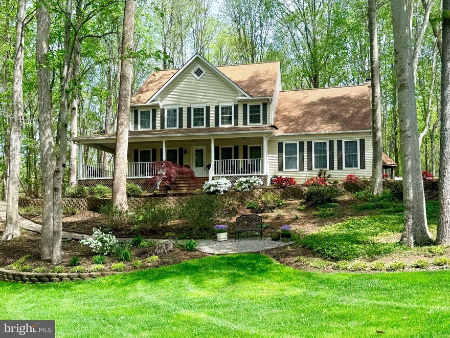 OPEN HOUSE Saturday from 11 am - 2 PM....Nestled on a serene 3.21-acre lot in the sought-after Bren Forest community this 3-level colonial is situated on a quiet cul-de-sac and backs to trees. The property provides a peaceful, private setting surrounded by mature landscaping and lush greenery. A charming wraparound porch allows you to enjoy the surroundings. Out back, is a spacious deck with a gazebo overlooking the majority of the 3 acres. Inside, the home features a well-appointed, updated kitchen with granite counters, ample cabinetry and gas cooking. The main level also includes an office, formal Living Room and Dining Room as well as an open Family Room with gas fireplace.  There are convenient laundry hookups in the Mud Room, while the current laundry area is located in the basement. Upstairs, you’ll find four spacious bedrooms with updated hardwood flooring that includes the Primary Bedroom, Siting Room & Primary Bathroom. In the lower level of the home there is a versatile bonus room complete with a full closet and window—perfect as a Fifth Bedroom, additional office, or guest space. Downstairs you will also find a Full Bathroom, Laundry Room, Storage and a Rec Room that offers a wood burning stove and walk-out to the rear yard. Additional highlights include durable 2” x 6” construction, vinyl replacement windows, an updated water heater (2024), and a WaterFurnace Envision geothermal system with an electric backup heating element. In 2014, two new 300-foot vertical wells/ground loops were installed and connected to the unit. The geothermal system delivers consistent indoor temperatures with highly efficient heating and cooling. Average electric bills over the past 12 months were approximately $188 per month. Outside, the property is enhanced by an underground irrigation system and a convenient side-entry garage, blending practicality with curb appeal. 30-year architectural roof was installed in 2010, Well Pump updated in 2025 - UV Light on well. Whole house water treatment system to included filter and softener.