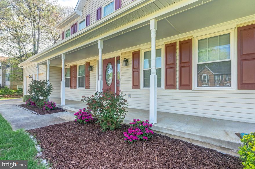 Ultra-Captivating Two-Story Home with Private Pool and Fenced Backyard! Idyllically nestled on a corner lot in a picturesque subdivision, this 4BR/2.5BA, 2,064 sqft property emanates classic American charm with beautiful colonial architecture, a spacious covered front porch, and cheerful landscaping. Marvelously illuminated with natural light, the immaculately maintained interior features a welcoming foyer, an openly flowing floorplan, a modern color scheme, an elegant formal dining room/potential office, and a spacious living room with French doors. Sensationally fashioned for entertaining, the open-concept kitchen includes stainless steel appliances, granite countertops, painted white cabinetry, a breakfast bar, a pantry, an electric range, a dishwasher, an under-mount stainless-steel sink, a dining area, and an adjoining family room with French doors to the expansive deck boasting a retractable awning. Venture into the fenced-in backyard to discover a sparkling inground swimming pool, a patio area, and ample green space. Let the day's cares melt away in the oversized primary bedroom with vaulted ceilings, a walk-in closet, and an en suite with a soaking tub, separate shower, and dual sinks. Three upper-level bedrooms are well-sized with dedicated closets. Other features: attached 2-car garage, laundry area, storage shed (great for pool equipment), 27 miles to Downtown Washington D.C., close to shops, dining, and schools, and more! Call now for your private showing!