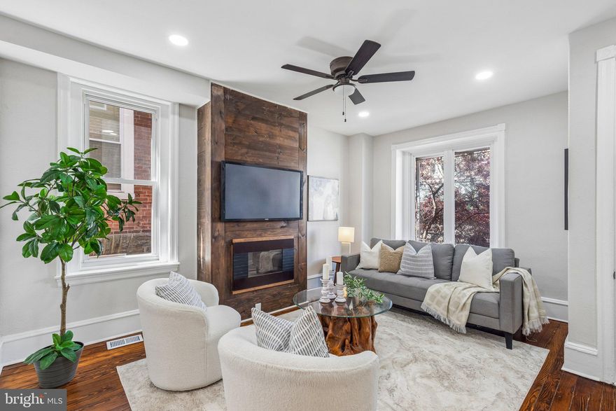 Welcome to 6122 Ross Street, a very well cared for and recently renovated home that perfectly balances original character with modern updates. Step onto the inviting front porch and enter through a vestibule featuring an original, detailed wood door. Inside, refinished hardwood floors run throughout the entire home.
The spacious living room is anchored by an electric fireplace with a classic wood surround, creating a warm and welcoming focal point. This space flows seamlessly into the dining room, which is filled with natural light from large windows. The kitchen is outfitted with brand new shaker cabinetry, quartz countertops, and brand new appliances, all complemented by ceramic tile flooring. Just beyond the kitchen is a dedicated laundry area and a conveniently located half bath. A door from the rear of the home leads to a private backyard.
Upstairs, the second floor houses four comfortably sized bedrooms and a full hallway bathroom featuring a tub-shower combination. The primary bedroom is positioned at the front of the house, offering a bright and spacious retreat.
For additional living space, the finished basement features durable LVP flooring and is perfect for a home office, gym, or media room. This home is complete with central heat and air for year-round comfort.
Conveniently located near Germantown Avenue shopping and dining, Awbury Arboretum, La Salle University, SEPTA Regional Rail stations, and major commuter routes including Lincoln Drive and I-76, this property allows for easy access throughout Philadelphia and beyond. 
Schedule a tour today!
