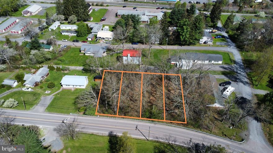 Affordable level building lot located in Loch Lynn Heights. Having trouble finding an affordable opportunity to build that fits your needs? This property offers that opportunity and has access to public water, sewer, public gas, and high speed internet. Although originally four town lots town building code requires a minimum of 10,000 square feet of acreage to build, making this suitable for one residential unit. Call for more information today!