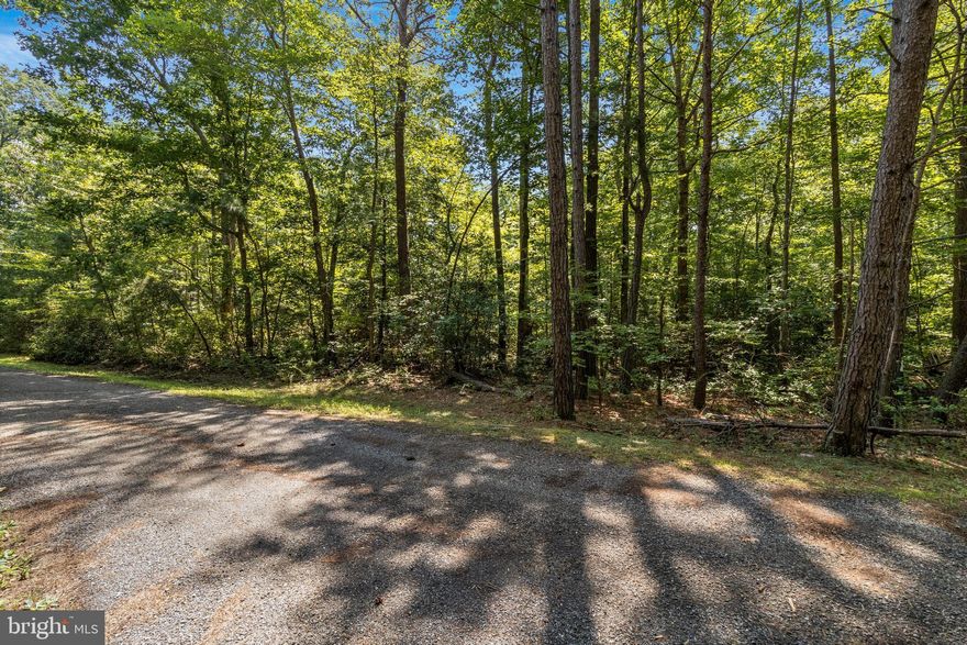 Buildable residential lot for sale in spectacular California, MD! 1.39 wooded acres set back on a private lane. This property provides the perfect blend of privacy and convenience for your new home. Already perc'd with 2 suitable locations - one on either end of the lot - which allows for flexibility with site planning. Full building permit plat and plans for a 2-story colonial home can be made available to buyers . This is an incredible opportunity if you're looking to build in St. Mary's County. Your builder or ours! Contact listing agent for more info.