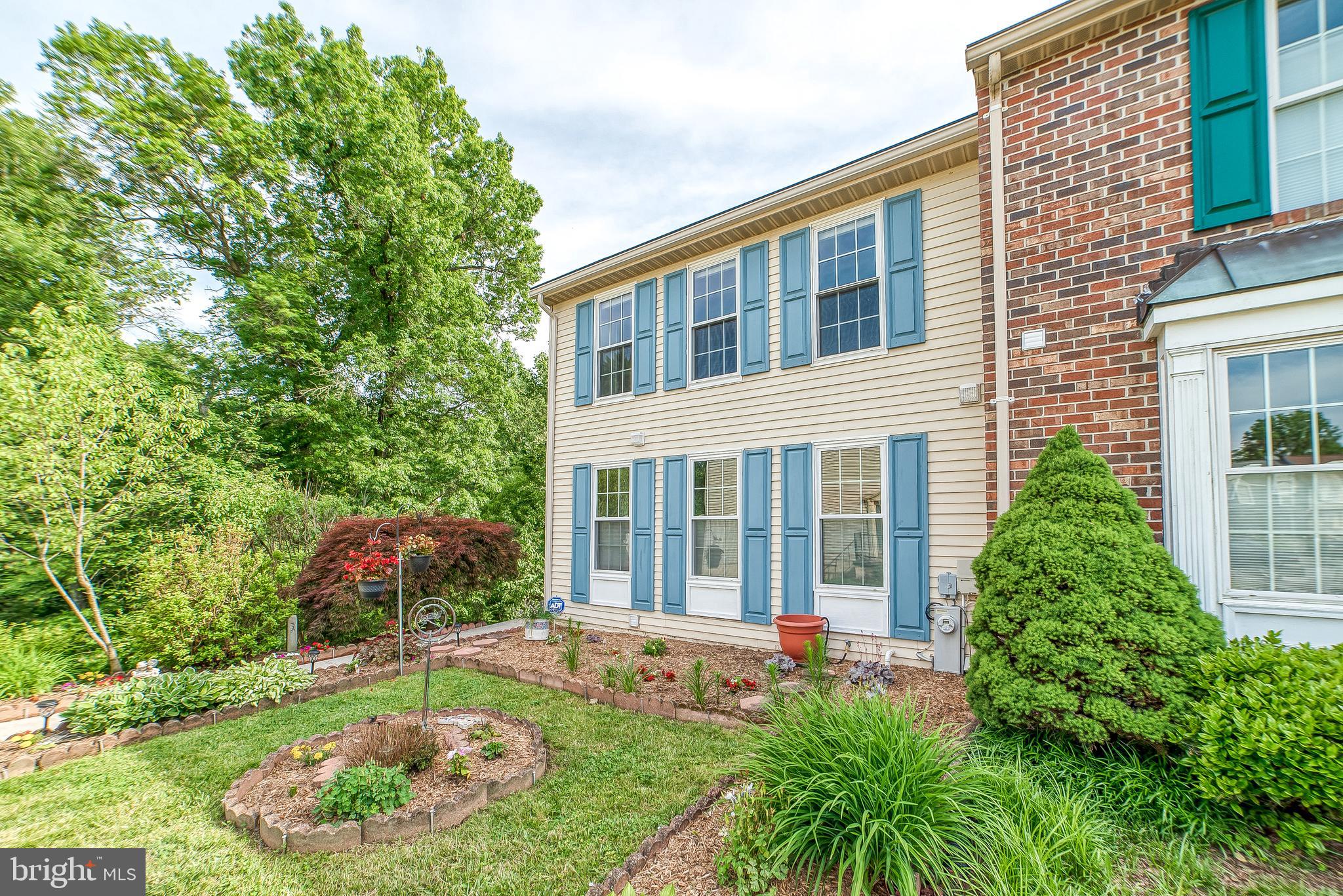 Start your staycation celebration! Rare find End of Group with 2 Owner's Bedrooms. Sprawling and beautifully appointed with the latest: Whirlpool Sunset Bronze kitchen appliances 5/28/19, roof 2017, water heater 5/25/19, gutters 2017 and the EXTENSIVE list of RECENT upgrades provided by original and only owner... Open and spacious living space with current and tasteful style - blinds, molding, flooring, neutral decor. Fantastic lower level with walk out to rear yard trimmed with trees. Lower level could be an in-law suite. A surprisingly secluded and park-like paradise. Generous sized rooms, eat-in kitchen, 2 upper level bedrooms each have their own full bath, living room with wood burning fireplace and walk out to deck. Lower level flex space affords opportunities for an additional bedroom, office, workout facility, in-law quarters. Laundry center located adjacent to existing family room in lower level.Tucked among woodland in a park-like setting. Upper and lower decks to relax and listen to the sounds of nature. Established landscaping and garden beds. Nature and gardening lover's oasis. Relaxing and private. Nature meets nurture. Snoozers will be Losers!!! Truly a unique opportunity!!