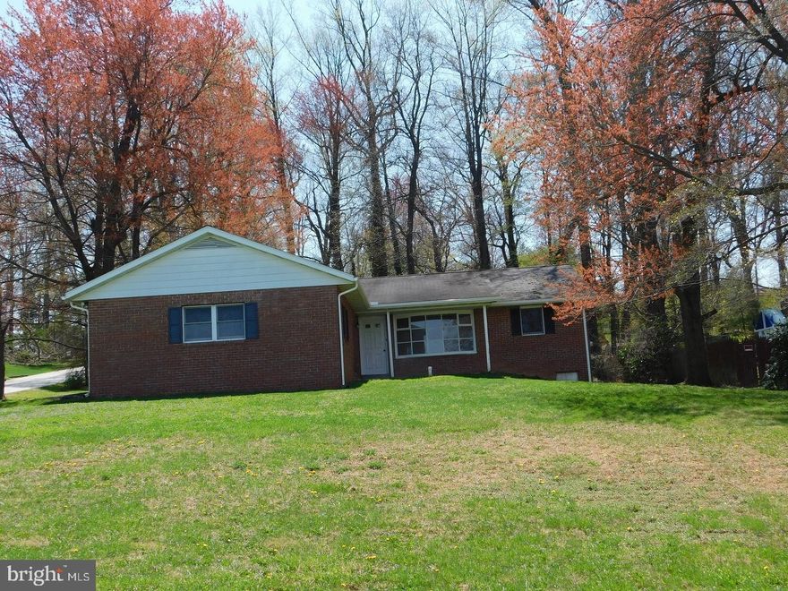 Great location on the edge of town for this one owner brick rancher on wooded corner lot. Great view of farmlands and meadow. Priced to sell.