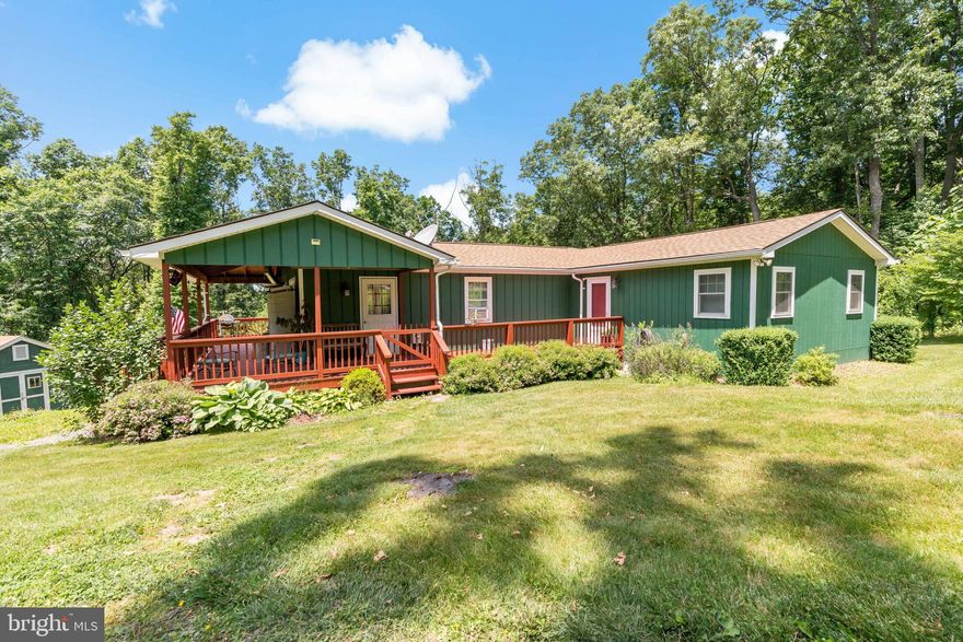 ***MULTIPLE OFFERS RECEIVED, DEADLINE IS SUNDAY, JUNE 2ND AT 3PM*** Welcome to your dream retreat! This charming cabin/rancher, nestled on over 2 acres of pristine land, offers the perfect blend of comfort and tranquility. Immaculately maintained, this home boasts 2 very spacious bedrooms and a third smaller bedroom/office, ideal for remote work with the new fiber internet service now available.

Step inside to find a beautifully updated kitchen and baths, with modern fixtures and finishes that perfectly complement the home's rustic charm. Enjoy the convenience of a separate laundry room and the peace of mind that comes with a new roof, new windows, and fresh paint throughout.

The wrap-around front porch invites you to relax and take in the serene surroundings, while the circular driveway provides ample parking for family and guests. A handy shed offers additional storage space for your outdoor gear and tools.

With 2 full bathrooms and an open, airy layout, there's little left to be done in this move-in ready home. Whether you're looking for a great weekend getaway or a full-time residence, this home offers it all. You won't find another property at this price that's as well-maintained and ready for any type of financing.

Don't miss out on this rare gem – schedule your visit today and experience the perfect blend of country living and modern convenience!