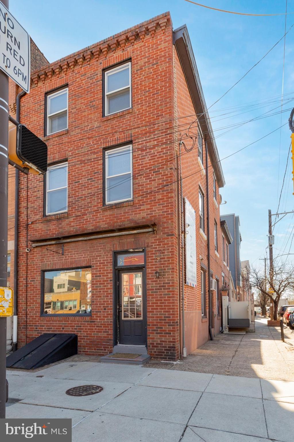 Welcome to 600 E Girard Ave, a well-maintained mixed-use building featuring modern residential units and a first-floor commercial space. The building offers spacious 1- and 3-bedroom apartments with hardwood floors, recessed lighting, in-unit laundry, and abundant natural light. Kitchens feature granite countertops, modern cabinetry, and counter seating, while bedrooms provide plush carpeting and ample closet space. Additional perks include private outdoor areas and a basement for storage or flexible use. The ground-level commercial space is currently leased as a barber shop, offering steady rental income. A turnkey investment or ideal owner-occupant opportunity—schedule your tour today!