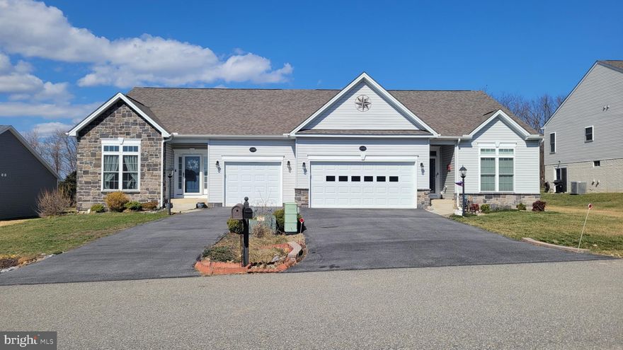 Better Than New - Check this lovely villa featuring open floor plan,  2 bedrooms, & 2 full baths.    Gourmet kitchen with granite countertops, large island & tiled backsplash, GE appliances, corner pantry & pendant lighting over large island - perfect for cooking and entertaining.    Relax in the family room with cozy gas fireplace or enjoy the bright sun room addition with ceramic tile floor. 2nd fireplace, and windows all around ($30,000 add-on), filling the home with natural light.    Additional highlights include convenient main level laundry, 9' ceilings, custom window treatments throughout, & full unfinished basement for expanding.   Located in desirable Active Adult Community 55+.  County taxes only and no HOA!   Nestled on back side of Freedom Hills, lot is bordered by trees in rear for maximum privacy....so nice to come home to.   Shows beautifully and clean as a whistle.  Ready to welcome it's next owner.   Call to schedule to see!