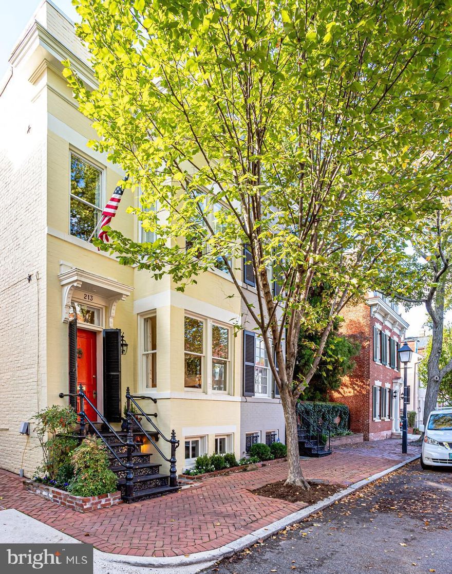 Located on one of the most beautiful streets on Old Town, 213 S. Lee Street, built in 1905, offers historic living with a modern aesthetic. Upon entering, the high ceilings are flooded with incredible natural light while hugged by original warm hardwood floors throughout - simply mood changing. Entertaining is a dream in this home as the living room with custom built-ins and a wood burning fireplace flows seamlessly into the large dining room with a cozy gas fireplace. A bright and spacious family room with floor of ceiling windows and a wood burning fireplace overlooks the lush garden. The half bathroom finishes out the main level. Enjoy the outdoors in the private, serene garden complete with a custom flowing fountain. Upstairs, the luxurious owners suite is flooded with sunlight and offers a large walk-in closet, spa-like bathroom with double vanity while overlooking the stylish garden from the Juliette balcony.  Two spacious additional bedrooms and a full bathroom can be found on the upper level. Unique to Old Town is a lower level which could be used as an office, recreation room or bedroom with its own full bathroom and private entrance from South Lee Street. All this is just steps away from your favorite King Street shops and restaurants and the Potomac River waterfront. Easy access to DC, Reagan National Airport  and major commuter routes. ONE-YEAR LEASED GARAGE SPACE IS INCLUDED.  Please see virtual tour..