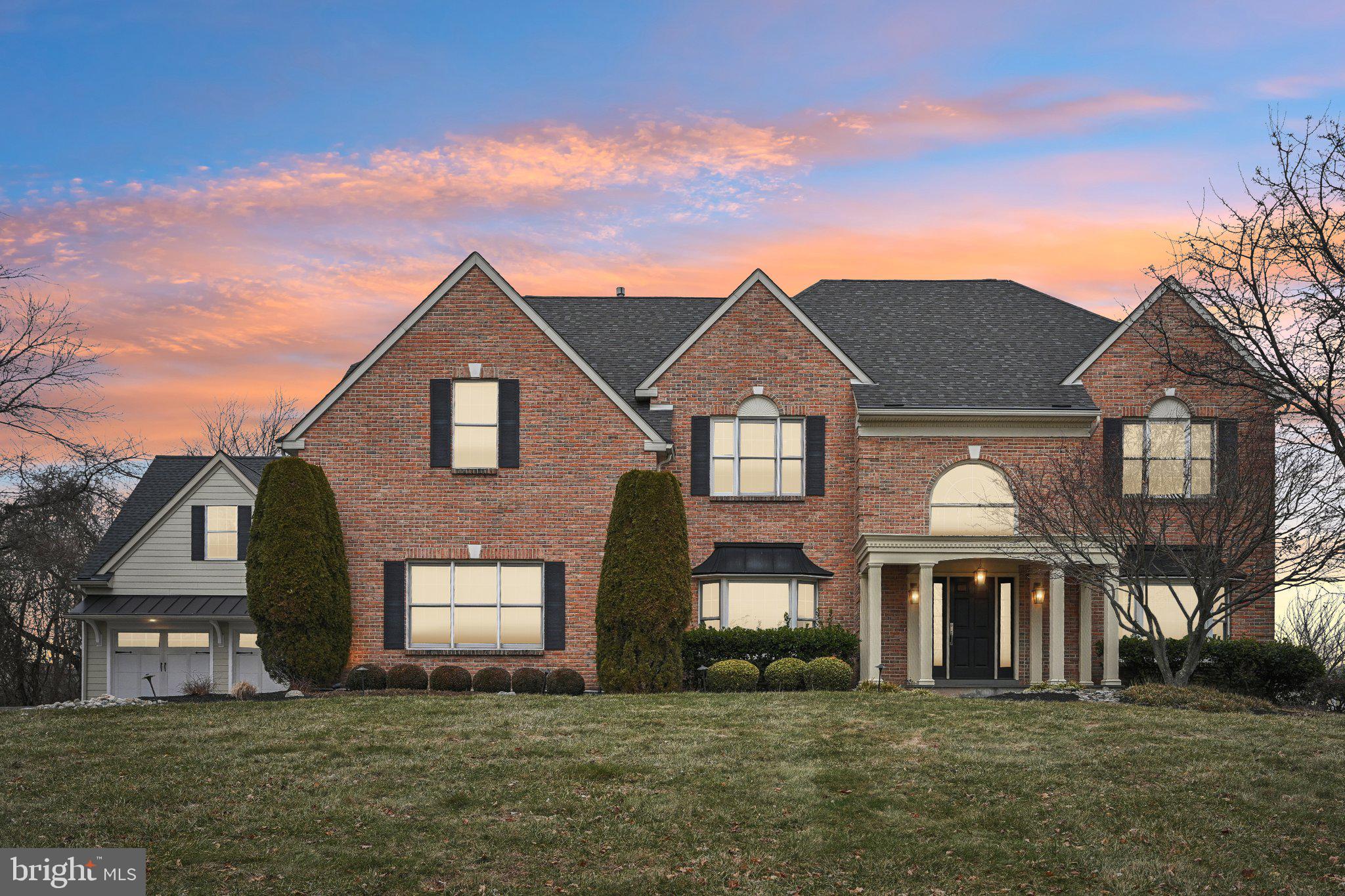 Fall in love with this beautiful and luxurious 4 bedroom, 4 and half bath brick colonial home located in Hatfield’s coveted neighborhood the Reserve at Hilltown. This original owner home offers over 5,600 square feet of living space set on ¾ of an acre. Located at the end of a cul-de-sac on one of the best lots in the neighborhood, this home borders a horse farm on one side for added privacy. Attention car enthusiasts, note the extra 2 car attached garage with 2 top-of-the line hydraulic car lifts in addition to the original 3 car attached garage, making enclosed parking available for 7 vehicles. The heated attached garage could also be converted into a spacious work area. The exterior of this home has been completely replaced with Hardie plank siding for an exceptional look. With amazing entertaining space on the first floor and tons of amenities in the finished basement, it is a must see. Enter the home into the gracious foyer where the grand staircase greets you. To the left is a large room perfect for an office or playroom. Across the foyer is a cozy living room with a gas fireplace that leads you into the large dining room. The eat-in kitchen features 42” wood cabinetry with stainless steel appliances including a double oven, gas cooktop, built-in wine fridge and an island with seating for two bar stools. The focal point of the first floor is the vaulted ceiling family room with gorgeous hardwood floors, stone surround gas fireplace, floor to ceiling windows for tons of natural light and a built-in bar area. As mentioned, this house was built to entertain and sliding doors lead you to the multi-tiered paver patio complete with low voltage lighting and a built-in fire pit and grill area. The patio overlooks the flat rear fenced-in yard where you can truly appreciate the privacy of the location of this house. A half bath and laundry room at the entrance of the 3 car attached garage complete the first floor. Upstairs the master suite is a true retreat, high ceilings, recessed lights and a sitting area create a luxurious escape. The spa-like en suite features a soaking tub, tile and glass shower and double vanity. Two large walk-in closets round out the master suite. All the additional bedrooms are great size with very nice closet space. Two of them are connected through a jack and jill bath and the 4th bedroom contains its own 3 piece full bathroom. Downstairs is the finished basement built for many uses, adding approximately 1,500 square feet of livable space. There is a dedicated gym space at the bottom of the steps with a beautiful full bathroom across the hall, equipped with a steam shower. The basement has lots of storage and closet space including a spacious room that could be utilized as a home office. The custom built in bar area has granite countertops, a soap stone bar counter, hidden refrigerator and freezer and a dishwasher. The glass cabinets and shelving are made to show off your collection of spirits. A sub zero 80” dual independent temperature zone wine fridge is just around the corner with space for your wine collection. A media room with custom cabinetry and built in surround sound sits right next to the bar area. Down the hall is a personal favorite, a pool table/cigar lounge enclosed with a pocket door. Two built-in insert 65” tv’s sit on both sides of the pool table. 2 separate dual fan systems remove all cigar smoke enjoyed here. Built-in bench seating, recessed lights and custom woodwork and beamed ceiling give this room a feel that you have to experience. Through a side door and up the steps you are led into the additional two car garage. 2 car lifts and a gas heater give this space the perfect room to work on your prized vehicles year round. This home has Lutron dimmable lights switches throughout the entire home along with a built-in speaker system. Exceptionally maintained throughout with excellent service history, this home is ready for its new owner and must be seen to be appreciated.