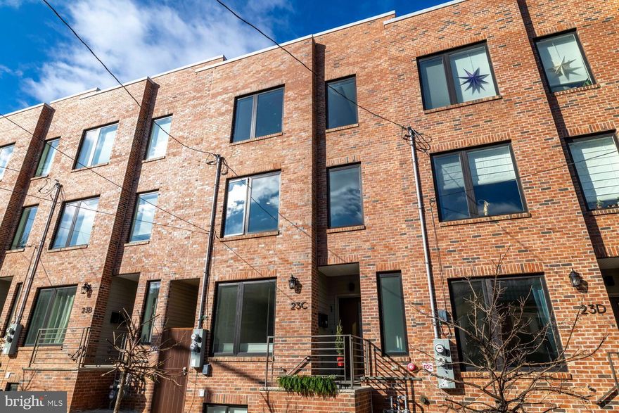 Welcome to this centrally located townhome in the highly sought-after Mt. Airy community. Enter through a charming vestibule, where custom Mirth Studios wallpaper on the stair risers sets a stylish tone as you head to the main living level.

The open-concept main floor is drenched with beautiful natural light. It features gorgeous white oak flooring, a sleek kitchen with stainless steel appliances, UltraCraft cabinetry, extra shelving, and a dedicated dining area. Thoughtful upgrades include automated blinds, a Minka ceiling fan, and a striking Le Feu bioethanol fireplace that anchors the living space. A convenient powder room completes this level.

The second level offers a spacious primary suite with a full bath. The primary suite offers indulgences such as a modern Minka fan, automated blinds, and walk in shower in the bathroom. This floor also features two additional bedrooms and another full bathroom with a soaking tub. A wide hallway with a laundry closet enhances functionality, while added storage beneath the main stairwell provides extra convenience. Throughout the home, high-end materials and design details elevate everyday living including shelving and wet bar in Pilot House and a whole-house humidifier integrated into the HVAC system.

One of the standout features of this home is the expansive full rooftop deck outfitted with mature trees- perfect for entertaining, relaxing, or enjoying city views. Off-street parking includes a high-voltage electric vehicle charging outlet. Low condo fees include master insurance, monthly water bill, snow removal, and professional management. Approximately six years remain on the 10-year tax abatement.

Schedule your tour today and experience luxury living in Mt. Airy.