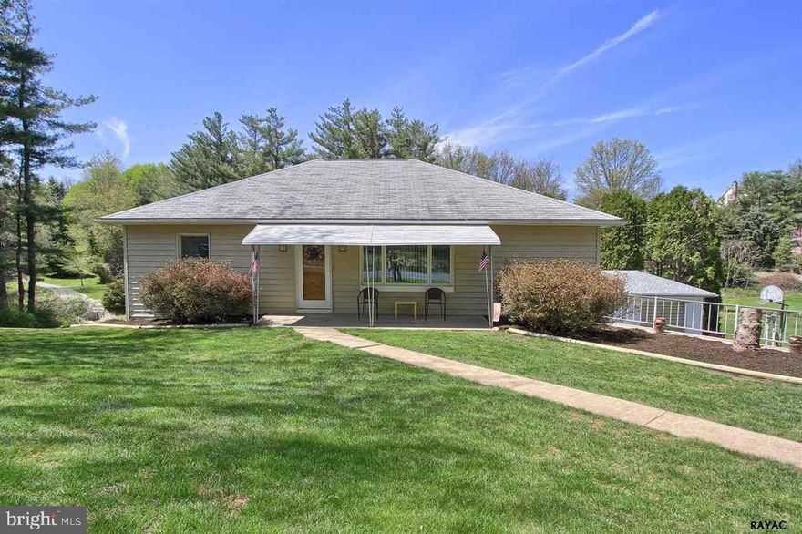Lots to love in this Rancher. Home Sits on 1.3 ac. that overlooks a park like setting with small stream. Updated kitchen with raised panel cabinetry, solid surface counters and breakfast bar. Enjoy the spacious sun-room while soaking in your hot tub! Walk out Lower level family room or possible in-law quarters. Added bonus a detached workshop & 1 car garage.