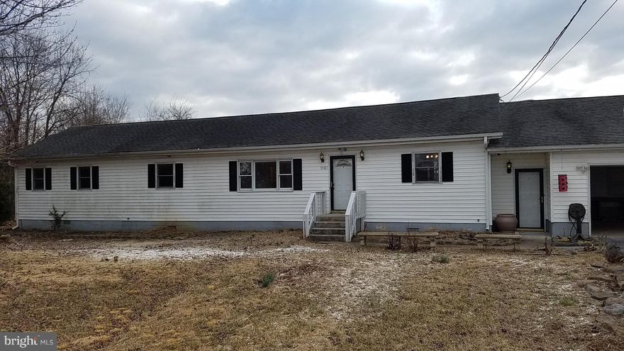Single level home with large fenced yard. Between Ranson/Charles Town and Martinsburg.  Great commuter location for MARC train stop or by car. Large garage and plenty of off-street parking.  Large Master Bedroom with en suite and walk-in closet, back covered porch.  Unrestricted and over half an acre!  Waiting for your finishing touches!