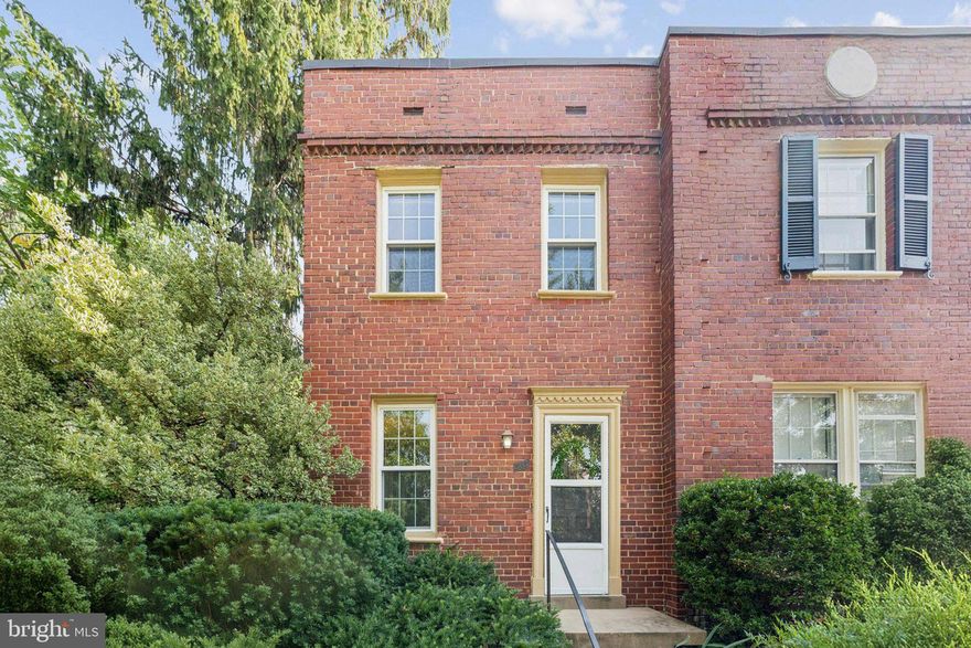 Welcome home to Arlington Village! This bright, 2 level end unit townhouse is tucked into the neighborhood and adjacent to parkland. Beautifully refinished parquet floors grace the living room while extra windows bring the outside in. The updated kitchen features Corian counters, lots of cabinet space, a gas range, brand new refrigerator, a built in microwave, and a backdoor leading to a small deck that is perfect for grilling!  A stacked washer/dryer has been added for your convenience. The Primary bedroom also features refinished original hardwood floors, abundant light and a large closet. The Den has many possibilities - a small 2nd bedroom, a separate office, guest room, hobby/craft room - you decide! The bathroom includes a deep soaking jetted tub/shower. Fabulous community amenities feature a competition sized outdoor pool - just a short walk away through the park - tennis courts, a community room, bike storage, laundry room and extra storage. Arlington Village is an historic community conveniently located just off Columbia Pike within walking distance to shops and restaurants or an easy commute to the Pentagon or DC. Stop by and see for yourself!