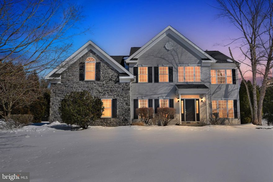 Welcome to refined elegance and everyday luxury in this stunning residence, where timeless design meets modern comfort in the highly sought-after Starfield community in Collegeville.

A grand two-story foyer sets the tone, with hardwood floors and crown molding flowing throughout the front of the house. Flanked by a sophisticated living room on the left and an elegant dining room on the right, the layout is both impressive and inviting—perfect for entertaining and everyday living alike. An arched doorway leads to the heart of the home: a beautifully appointed chef’s kitchen featuring stainless steel appliances, gleaming granite countertops, a spacious center island, tile flooring, and a bright breakfast area. The kitchen opens to a dramatic two-story family room highlighted by hardwood floors, a breathtaking wall of windows that floods the space with natural light, and a floor-to-ceiling stone fireplace that serves as a striking focal point. The first floor is thoughtfully completed with a cozy private office, a stylish powder room, and a convenient laundry room.

Upstairs, the luxurious primary suite offers a true retreat. The expansive bedroom boasts a tray ceiling, generous walk-in closets, and an intimate sitting area. The spa-inspired en suite bath features a private water closet, an oversized, beautifully tiled walk-in shower, dual vanity, and dedicated space for a dressing table. Three additional bedrooms—one with hardwood flooring and two with plush carpeting—provide ample space for family or guests, along with a well-appointed hall bath.

The finished lower level elevates the home’s entertainment potential with a sprawling recreation area offering endless flexibility - perfect for game nights, movie marathons, or hosting holiday celebrations. Two distinct bar areas - one a wet bar with  a dishwasher -  including elegant archways and hardwood flooring, a carpeted living area, and a convenient half bath create the ultimate setup for hosting gatherings in style. You'll also find three unfinished storage areas  in the basement.

Step outside to a spacious and private backyard oasis, complete with a deck perfect for relaxing or entertaining, and a storage shed for all your outdoor essentials.

Located in the award-winning Spring-Ford Area School District, this ideally-situated home is just two miles from Providence Town Center—offering Wegmans, the Movie Tavern, and a variety of dining and shopping destinations. Easy access to Route 422 connects you effortlessly to the renowned Philadelphia Premium Outlets and the world-class shopping and business hub of King of Prussia. This is more than a home—it’s a statement of lifestyle, comfort, and distinction.