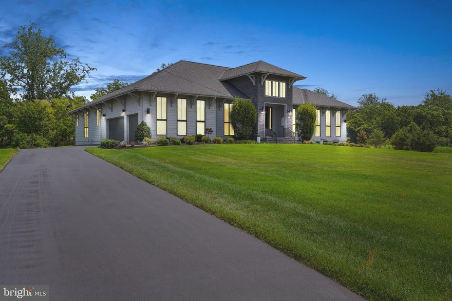 Located in the most desirable community, the Grant at Willowsford, this Super STUNNING LINE K Nooderwind Model boasts an abundance of natural light, quality craftsmanship and rich materials in every corner!  Artistic nuances blend with contemporary luxury and functionality in this masterpiece designed by the highly acclaimed and world renowned Dutch designer, Piet Boone.  Over 9,000 expansive square feet of perfection on two levels situated on a huge .89 acre CORNER LOT adjacent to CONSERVATION land.  Over 250K in upgrades include a phenomenal Gourmet Kitchen with custom quartz countertops. WALK OUT lower level with a wall of windows creates an entertainment area complete with a spacious en-suite and several bonus rooms.  Main Level 12 foot ceilings and 10 foot doors you can only find in this magnificent LINE K model!  Please see documents for a complete list of spectacular features.  Phantom Screening, Two Bose systems with built in speakers, Dual zone heating and cooling each with electronic air filters and HEPA filter systems, Central vacuum, landscape lighting, irrigation system plus so much more!
The resort-style community of Willowsford offers a multitude of amazing amenities including community pools, clubhouse, well equipped fitness center, lakes, fishing ponds, a water splash park and the Willowsford Farm & Conservancy which is is one of the leading agrihoods in the country!  Easy access to commuter routes, Dulles Airport, shopping, restaurants, breweries and vineyards and all that the beautiful rolling hills of Virginia has to offer!