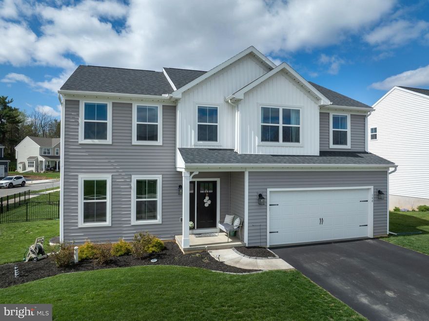 Some homes simply check the boxes & then there are the ones that raise the bar. This better than new 2024 Blue Ridge floorplan in the popular & oh so convenient Logan Greene subdivision delivers a level of comfort, style & thoughtful upgrades that today’s buyers crave. From the welcoming covered front stoop to the sleek Govee permanent lighting that adds year round charm, every detail has been dialed in for modern living.  Step inside to 9’ ceilings, a bright foyer with luxury vinyl plank flooring & glass French doors that lead to a flexible front room ready to serve as a home office, playroom, or creative space. The heart of the home is the beautifully designed eat in kitchen, where striking upgraded tuxedo-style cabinetry pairs crisp white uppers with rich navy lowers, creating a timeless, upscale aesthetic, quartz countertops, subway tile backsplash, a walk in pantry plus a second pantry, an oversized island with a breakfast bar & trio of sleek pendant lights come together in a space that’s as functional as it is stunning. Sliding doors open to a composite deck overlooking the aluminum fenced backyard perfect for unwinding or entertaining. The kitchen flows effortlessly into the spacious family room, creating a warm, connected main level layout.  Upstairs, a generous loft anchors the second floor, leading to a serene primary suite complete with a private full bathroom featuring a dual vanity & tile walk in shower with glass door plus a walk-in closet. Three additional bedrooms, two with walk in closets, a full hall bathroom & a convenient laundry room round out the upper level. The full unfinished basement offers endless potential with an egress window, rough ins for a future half bath & radon mitigation already in place.  With natural gas heat, central air, a main level half bath & an attached 2 car garage, this home blends comfort & practicality with ease. Ideally located less than 2 miles from I 99, moments from historic downtown Bellefonte & just 9 miles from Penn State/Beaver Stadium, it’s the perfect balance of convenience & community.  A polished, upgraded, move in ready home in a prime location — this one truly wraps everything up into a picture perfect package.