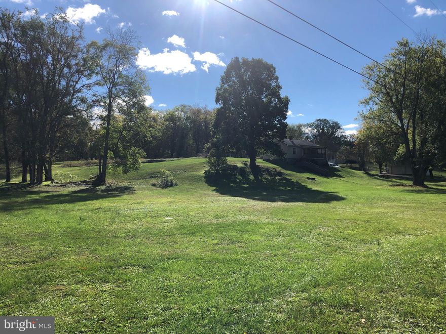This house can be your home sitting up on a hill. House does need work...divided into two one acre lots. Property is priced "AS IS". Unrestricted, situated off the main highway...right in Kearneysville. Just Reduced!!!  Adjoining lot conveys...Tax ID 073B001900000000