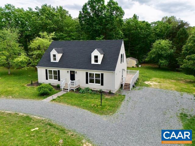 Located conveniently between Richmond and Charlottesville, this property is in a sought after location at Zion Crossroads. Effortless access to I-64, with a variety of shopping and dining just moments away. Situated on a fairly level, corner lot and surrounded by mature trees for added privacy. This Cape Cod home on 1.5 acres has been recently remodeled, and feels brand new! The interior features new flooring throughout, beautifully tiled bathrooms with new vanities, stainless steel appliances in a fully equipped kitchen, and a spacious brand-new deck that makes outdoor entertaining a joy for gatherings with friends and family. Property has 4 bedrooms - 2 on the main level, with one being the primary en-suite and 2 more sizeable bedrooms on the 2nd level with 6 person occupancy permitted. Additionally, with FireFly fiber internet available, remote work is a breeze. NEW DECK! NEW ROOF! HVAC and Hot Water Heater replaced in the past few years. Wonderful property to call home!.,Granite Counter,White Cabinets