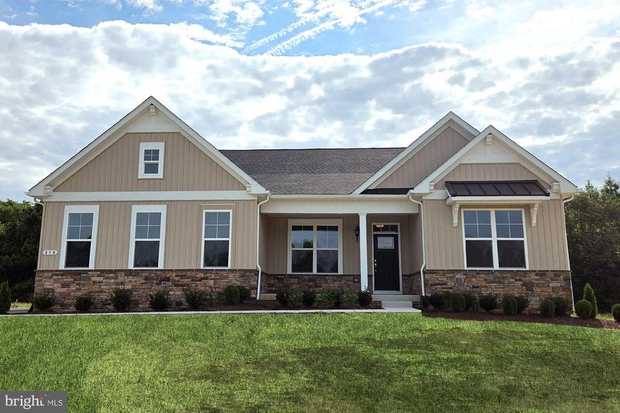 Quick Delivery. Welcome home. With its classic architectural exterior and flexible layout, this popular ranch design allows for effortless single-level living. The well-appointed gourmet kitchen features generous storage, upgraded 42” white cabinets with brushed nickel hardware, quartz countertops, stainless steel appliances including a double-wall oven, large kitchen island with quartz countertops, pendant light rough ins, and cabinets on both sides.  The kitchen opens to a spacious Great Room with a fireplace, additional windows, an 8 ft. extension, and recessed lights. We have added a 2ft extension from the garage through to the owner’ suite. The private owner’s suite offers a tray ceiling with recessed lights, oversized walk-in closets, a luxury bathroom with walk-in shower and a free-standing tub. A split-bedroom layout offers two additional bedrooms on the other side of the house with a shared bathroom. We have also included a library for some additional private space or a home office.  The included unfinished basement has 9ft ceilings, a rough-in for a future bathroom and a 6 ft areaway with sliding door.  LVP flooring is included in the first-floor hall, powder room, drop zone area, laundry room, great room, kitchen, breakfast room, pantry, hall to bedrooms 2 & 3, hall to owner’s suite.  Located in the Caesar Rodney School District. Sidewalks and streetlights, public water, public sewer, and natural gas.  Close to shopping, restaurants, and easy access to highways. Pictures are of similar home. Call about our Military appreciation incentive (Active/Retired Military only). Please contact on-site builder sales manager for details on incentives. 
On-site, unlicensed salespeople represent the seller only.