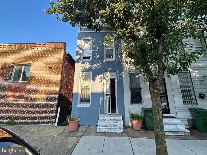 Welcome to this brick townhome in the neighborhood of McElderry Park. This home  features an open main level concept with laminated plank flooring that flows throughout the main and upper levels. The seamless integration of the living, dining, and kitchen areas creates a warm and inviting atmosphere. The kitchen is spacious and consists of wood cabinets, tile flooring and appliances. When you go to the upper level, you will find a full bathroom with tub shower and  two well-appointed bedrooms with built-in cabinets. The lower level is unfinished but awaits your design and personal touch to expand living space. Home is located in a vibrant city setting and is close to everyday conveniences. In fact, it is walking distance to public transportation, Sunshine Market,  local restaurants, and has easy access to major roadways such as US-40 and I-83.