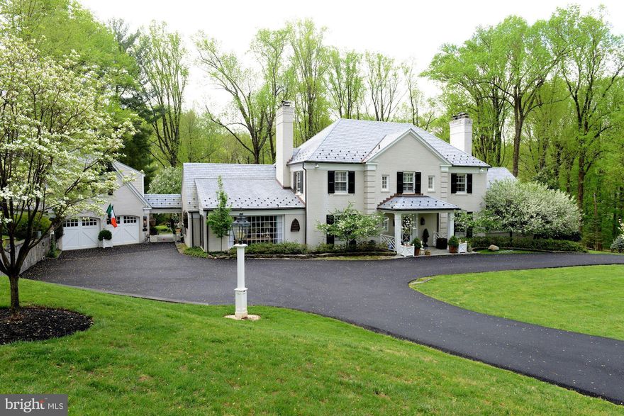 *************** HUGE PRICE REDUCTION**********Welcome to this charming, modern, country home nestled in Potomac's prestigious "Potomac Falls" neighborhood. The setting, the curb appeal, the landscaping - this home has it all. Beautiful Kitchen renovation - marble counters, large island and gas cooking. Separate walk-in pantry. Bay window with built-in seating overlooks magnificent back yard. First floor Library with built-ins, cozy wood paneled Family Room with tray ceiling, wet bar and wood burning fireplace is where you'll want to curl up with a book. Dining Room with built-in corner display cabinets and french doors to back terrace. Formal Living Room with wood burning fireplace and door to terrace. Light and bright Sunroom with gas fireplace, built-in seating and three walls of windows is a room in which to relax. Exit the mud room to back porch with ceiling heater and  breezeway to garage. Above 2 car Garage is a Home Office / Studio with Full Bath #5. Currently used as a very welcoming guest suite. Upper level of main home boasts 4 Bedrooms and 3 Full baths. Two of the Bedrooms have en-suite baths. The Attic is very large, floored and could easily be converted into more living space.  The landscaping is magnificent with spectacular specimen flowering trees - Crabapple, Pear and Dogwood. Boxwoods surround a whimsy garden and there is a gorgeous pale pink rose climbing up the side of the garage. Just like Nantucket! No description can do this home justice. Make an appointment! Come see.