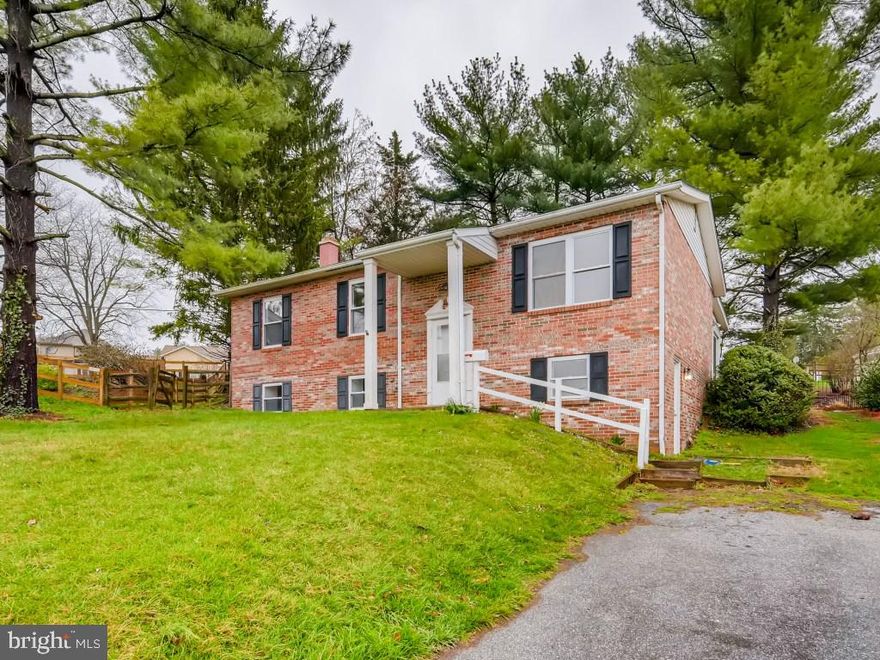 SOLD AS-IS - Cash or renovation loan Terrific split foyer with great natural lighting, Hardwood floors, nice open floor plan. Off the dining room and kitchen is a lovely three season room with sliders all around and a wood burning stove. Downstairs features family room with old barn wood and fireplace, a 4th bedroom/office with access to outside. Plenty of storage and laundry on the lower level. Large fenced in backyard. Just up the street from Kings Park.