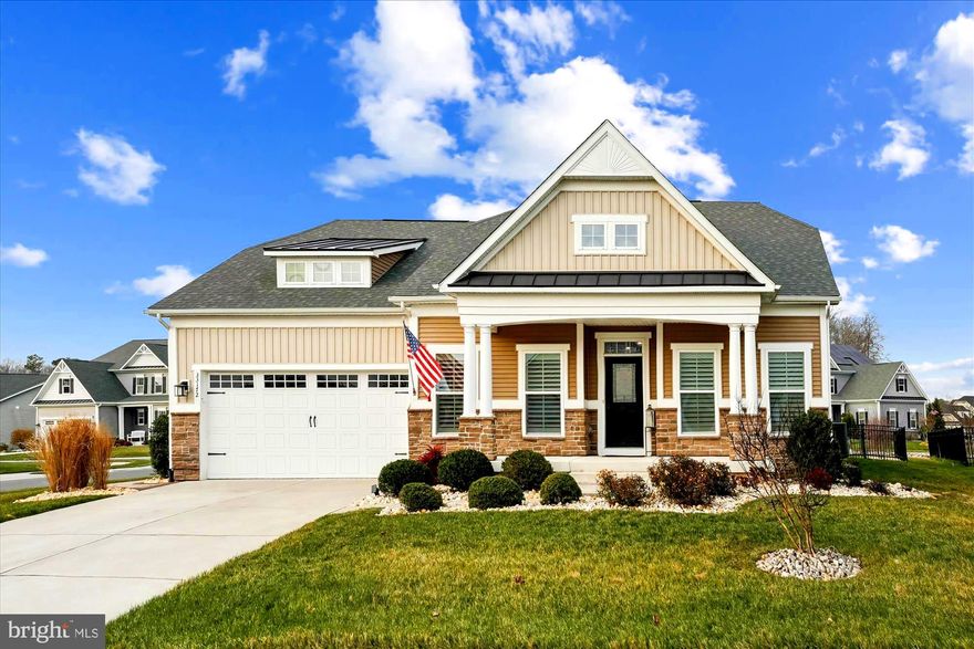 Welcome to this beautifully appointed four-bedroom, three-bath coastal retreat located in the highly desirable gated community of The Reserves, just three miles from downtown Bethany Beach. This charming two-story NV Ocean Breeze model offers timeless curb appeal, enhanced by attractive landscaping that creates a warm and inviting first impression.
Designed for both comfort and coastal living, the home features an open, light-filled floor plan with expansive living spaces ideal for entertaining or relaxing. Ten-foot ceilings and striking architectural archways make a bold statement in the kitchen and great room, adding character and elegance throughout.
The spacious foyer welcomes you with a bright private office to the left, highlighted by a stunning tray ceiling. To the right, two generously sized guest bedrooms share a full bath, providing comfort and privacy for visitors. Straight ahead, through a graceful archway, you’ll find the gourmet kitchen—beautifully appointed with abundant white cabinetry, stainless-steel appliances, and quartz countertops. Cooking is a pleasure with the four-burner gas range, wall oven, and microwave. A uniquely designed oversized island complements the walk-in pantry.  The easily accessible but situated away from the main cooking area is the exclusive built-in coffee bar with a mini-refrigerator, making this space perfect for both everyday living and entertaining.
Adjacent to the kitchen is a sunny dining area with a vaulted ceiling, ideal for enjoying morning coffee or casual meals. Tucked privately behind the dining space is the primary bedroom suite, featuring a spa-like primary bath with dual sinks and a luxurious Roman shower. Conveniently located outside the suite is the laundry room, which provides direct access to the large two-car garage.
The second level offers a private retreat with a spacious fourth bedroom, a full bath, and a versatile loft/media area—perfect for lounging, movie nights, or hosting guests who will enjoy having their own dedicated space. There is a large storage area on the upper level for your convenience.
Step outside to a fully fenced backyard featuring an inviting porch area and step down to the hardscape patio and fire pit area.  This is ideal for outdoor entertaining, family gatherings, or peaceful evenings enjoying the coastal breeze.
Just minutes from the coast, this meticulously maintained home offers the perfect balance of secure community living with easy access to beaches, dining, and recreation—delivering privacy, comfort, and seaside charm.