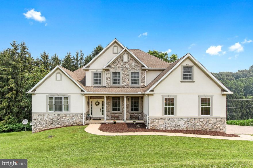 This gracious 4BR 3.5 BA Colonial offers delights at every turn, a versatile layout & a scenic, secluded 1.2 acre lot with not a neighbor in sight! Glossy hardwood floors in the inviting foyer lead to a handsome formal Dining Room with picture frame moldings & tray ceiling, & a light-filled 2-story Family Room with floor to ceiling stone Fireplace off the large, open Kitchen. Your inner chef will love the walk-in pantry, granite, tile & stainless steel, generous island/breakfast bar, handy Butler's pantry & breakfast nook. Step out to the deck & enjoy the peaceful setting. Additional surprises include first floor office & first floor Owner's suite equipped with tray ceiling, walk-in closet & tile bath with jetted tub, separate shower, linen closet & dual vanity.  Upstairs a second Owner's suite with walk-in closet & private bath, 2 additional bedrooms & hall bath provide comfort for family & guests. Instant hot water heater, 2-zone heating & huge walk-out basement with rough-in for full bath are added bonuses. The gorgeous location, huge yard with room to run & views for miles, & easy access to local amenities are the icing on this lovely cake. Move right in & enjoy!