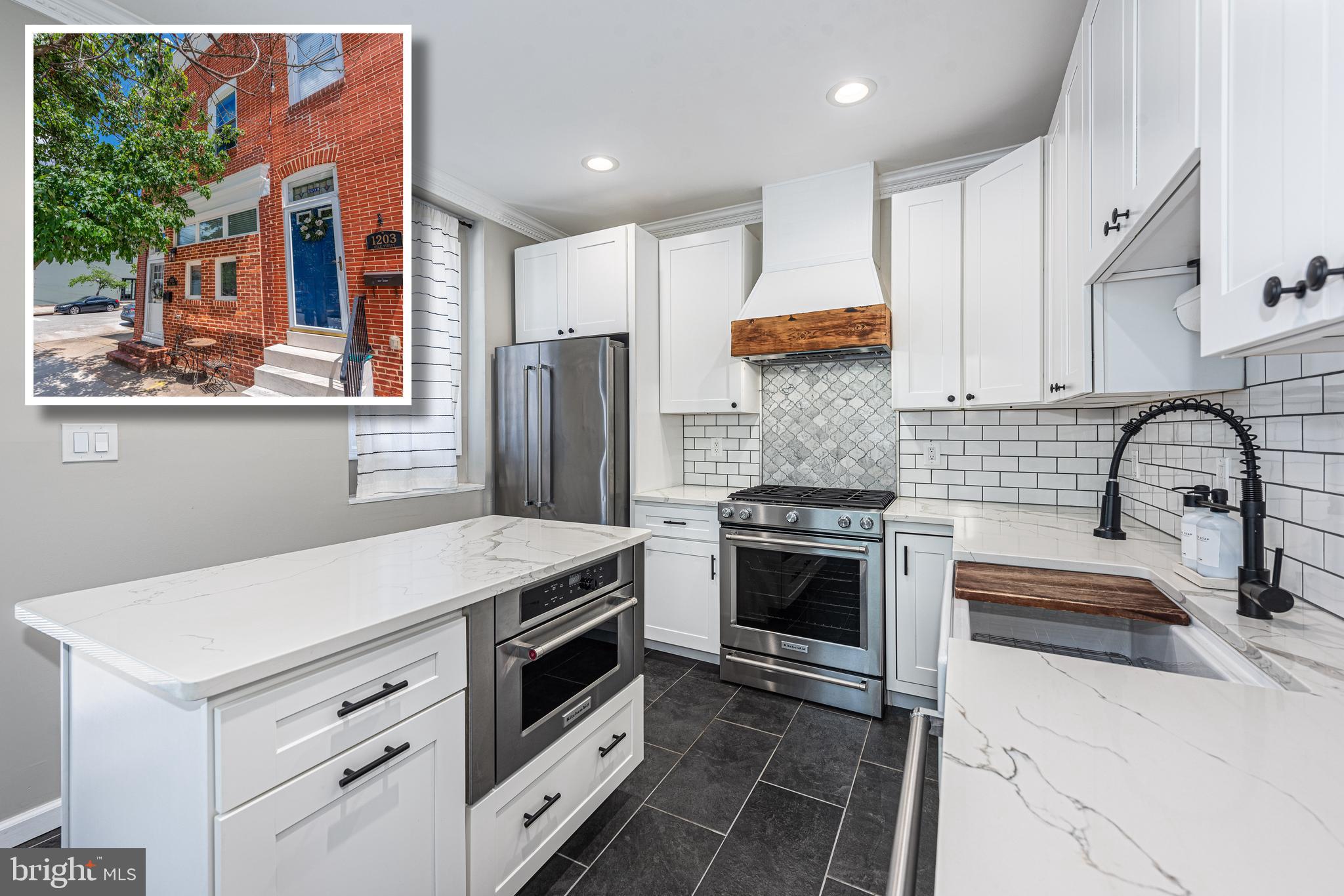 BEYOND SPECTACULAR END OF GROUP RENOVATION WITH A ROOFTOP DECK AND OFF STREET PARKING! Welcome to your dream home! This home perfectly blends modern luxury and thoughtful design and features 11 ft. ceilings, hardwood floors, and exposed brick throughout, a designer island kitchen with a large island, Quartz counters, and a premium Kitchen Aid appliance package, a convenient main level half bath, upper level with 2 bedroom suites including a Primary bedroom suite with a luxury bath featuring a walk-in glass enclosed shower, double vanity, and heated floors, bedroom level laundry with new LG washer and dryer, a finished basement with 2 additional bedrooms and a full bath with heated floors, a 2nd level rear deck which leads to the rooftop deck with sweeping views of the Harbor, Domino Sugar sign, & Silo Point, and convenient off street parking! There are thoughtful details throughout this home including smart lighting throughout, energy certification through BGE, all new windows, a custom coffee/dry bar with a wine fridge, and a new roof and rooftop deck. Convenient location - close to restaurants, shopping, and a quick commute to major roadways. This is city living at it's best!