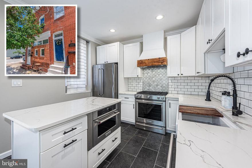 BEYOND SPECTACULAR END OF GROUP RENOVATION WITH A ROOFTOP DECK AND OFF STREET PARKING!  Welcome to your dream home!  This home perfectly blends modern luxury and thoughtful design and features 11 ft. ceilings, hardwood floors, and exposed brick throughout, a designer island kitchen with a large island, Quartz counters, and a premium Kitchen Aid appliance package, a convenient main level half bath, upper level with 2 bedroom suites including a Primary bedroom suite with a luxury bath featuring a walk-in glass enclosed shower, double vanity, and heated floors, bedroom level laundry with new LG washer and dryer, a finished basement with 2 additional bedrooms and a full bath with heated floors, a 2nd level rear deck which leads to the rooftop deck with sweeping views of the Harbor, Domino Sugar sign, & Silo Point, and convenient off street parking!  There are thoughtful details throughout this home including smart lighting throughout, energy certification through BGE, all new windows, a custom coffee/dry bar with a wine fridge, and a new roof and rooftop deck.  Convenient location - close to restaurants, shopping, and a quick commute to major roadways.  This is city living at it's best!