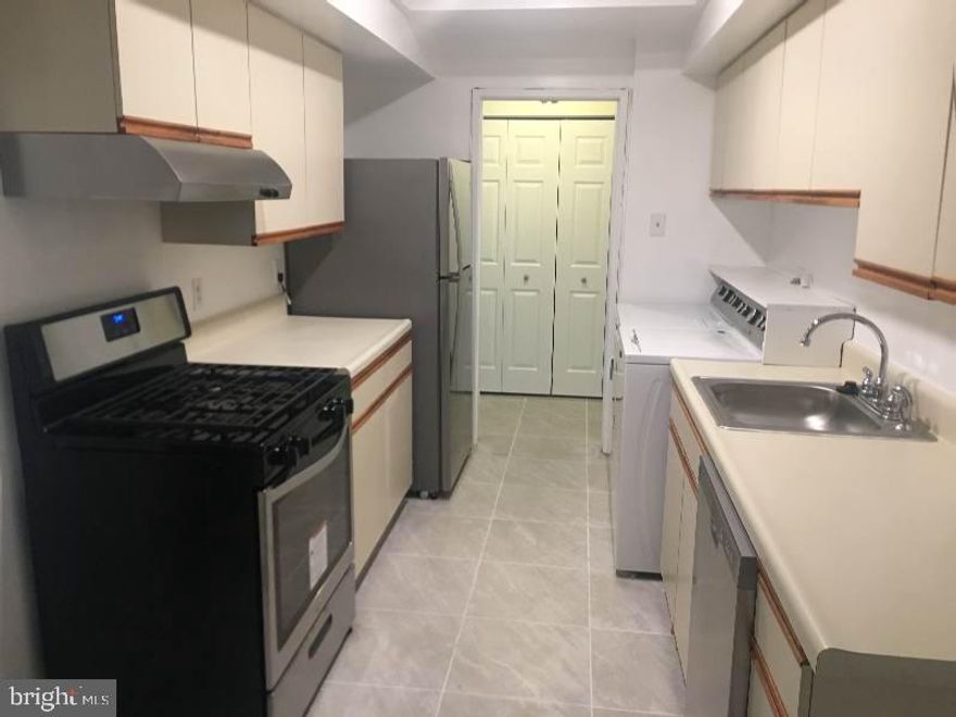 Investor Opportunity to own this beautiful renovated 2 Bed 2 Bath condominium in sort after neighborhood in Largo  Seller prefers to sell to Investor considering Tenant Agreement in process for $1,700 per month  Quiet Condominium Community and extremely well managed and maintained  Spacious Bedrooms with fresh carpets  Big Living and Dining Rooms  Beautifully laid out and remodeled Kitchen with stainless steel appliances (i.e. Refrigerator, Dishwasher, Range, Disposal)  Washer and Dryer in unit  Private Patio with lots of space and lawn area   Steps away from the overlooking outdoor Pool  Conveniently located near I-95, Largo Town Center Metro Station  Prince George's Community College, and Six Flags  3 Parking Spaces available for owner  Water included in Condo Fee.