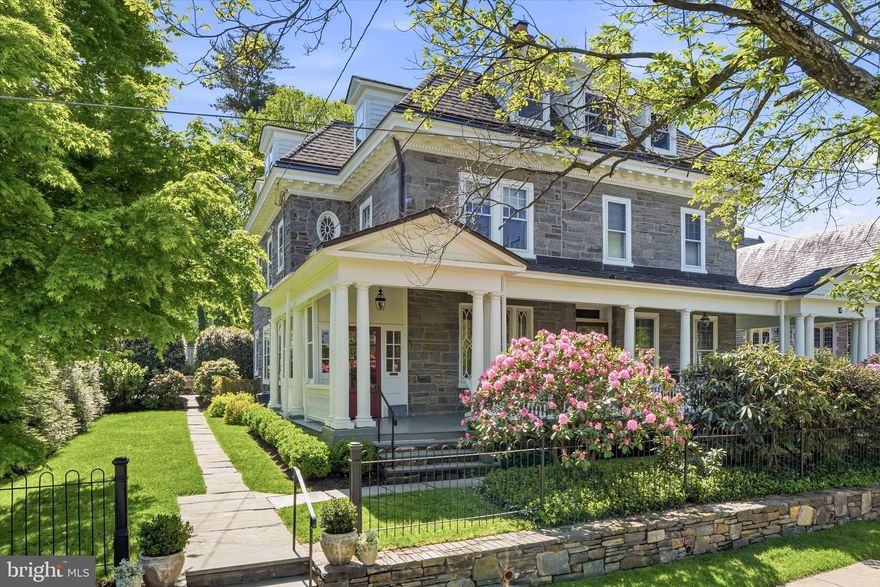 What a solid beauty! 5 bedrooms, 2.5 bathrooms, 2800 square foot stone twin, architecturally rich and thoughtfully maintained, with evident pride of ownership throughout. Beautiful hardwood floors span the home, complimented by significant updates including a new septic system (2021), stone wall and gateposts (2023), remodeled patio and new retaining walls (2023), and efficient Bosch HVAC systems (2024). Located in a highly desirable location that is walkable to the shops and restaurants of Germantown Avenue as well as the trails of the Wissahickon Valley Park. Ideally situated for convenient access to public transportation; walkable to SEPTA rail & bus lines.
The entry of this stately Colonial Revival home is framed by generous round columns and showcases a balance of strength and symmetry that you will see echoed throughout the house. A spacious, full width front porch, set behind a natural screen of greenery is the perfect welcoming to this beautifully updated and maintained home. 
Enter a three-season, enclosed porch with expansive picture windows that allow for maximum natural light. A graceful transition, bridging the interior space with outside views, providing both light and a sense of privacy. Continue through a single-light over panel door that offers an early glimpse of the home’s classic architectural detailing.
Once inside, here is the floorpan:
Step into an inviting foyer that seamlessly integrates with the living space. The adjacent living room has 10’+ ceilings, a new (2021) gas fireplace beautifully framed by floor to ceiling built-in bookshelves, and a Gothic Revival-inspired window with decorative tracery that is the natural focal point.The dining room entry is elegantly defined by classical columns and crisp dentil moulding, showcasing the consistent detail throughout the home. Classic wainscoting wraps the walls and a decorative fireplace adds to the warmth and character of this room. A deep coat closet is tucked away in the corner, just under the main staircase. Beyond the dining room is a wonderfully appointed kitchen. Thermador appliances, gas cooktop, quartz countertops, marble backsplash, floating shelves, custom island, plenty of cabinetry and a back staircase. This side of the house sees the morning sun and you could not ask for a better breakfast spot!
The back of the house has a large laundry room, a separate half bathroom and access to the remodeled flagstone patio, which is simply delightful. The rear yard is enclosed on 3 sides with a red cedar fence that nicely frames the perennial gardens and green space.
Upstairs, the second floor has 3 light-filled bedrooms. There is a jack-and-jill bathroom with an additional hallway entrance and a linen closet.
The third floor is your private retreat! Here you can have your primary bedroom, bathroom, separate nursery or office plus a versatile bonus room that is ideal for work, wellness or unwinding. One zone of the HVAC system is conveniently located in a hall closet on the third floor.
A full unfinished basement holds a Buderus furnace, HVAC, an 80 gallon hot water heater and offers plenty of storage space.
36 E has been thoughtfully updated, meticulously maintained and presents a rare and exceptional turnkey opportunity.
Listing Agent is related to sellers.