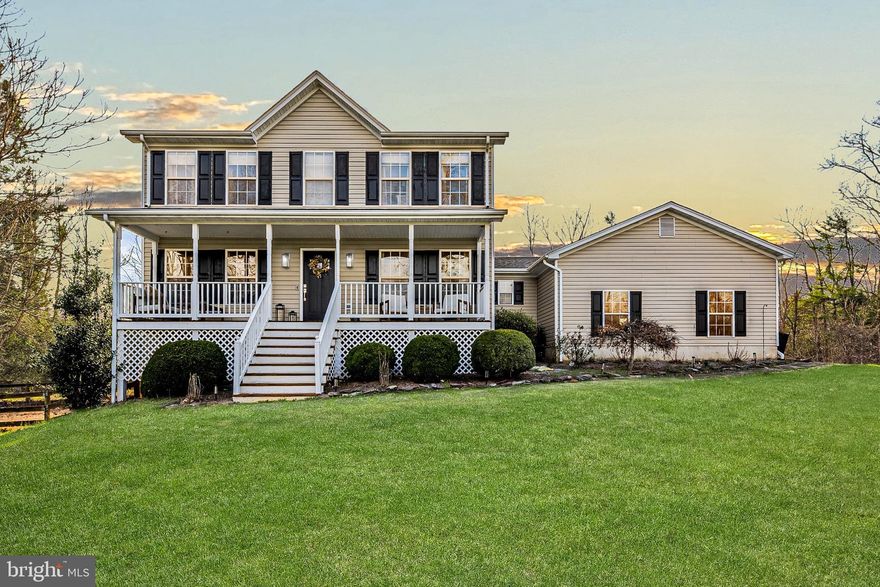 Discover the epitome of mountain views and river front living at 13154 Mill Creek Ct, Reva, VA 22735-2339. This captivating Colonial-style home has been completely remodeled in 2022!! It's a beautiful combo marrying modern luxury with breathtaking natural country beauty. Nestled on a picturesque hillside, the property offers an incredibly rare feature – stunning mountain views from the back deck, and rear of the property also coupled with a serene backdrop of the Hazel River. As you step inside, you're greeted by an inviting space featuring an expansive covered Front Porch, perfect for soaking in the peaceful tranquility of the surroundings. The interior exudes elegance with an open formal living room den,  Dining room, and a recently updated eat-in Kitchen boasting quartz counters and stainless steel appliances. Cozy up in the open family room with its fireplace, or enjoy the convenience of the Laundry-Mud Room and attached two-car side load garage. Retreat to the Owner's Suite with views of the mountains with its walk-in closet and private bathroom. The upstairs also features two additional spacious Bedrooms and a full bath  The full unfinished walkout lower level offers potential for storage or future expansion, complete with a bath rough-in. Outside, revel in the privacy of the fenced back yard and a dog run on 5 peaceful acres, extending down to the Hazel River. Oh did we mention HIGH SPEED Comcast Internet!! Recent updates include a new roof in 2021, HVAC replacement in 2020, water heater replacement in 2018, and a new well pump. Enjoy easy access to Rt 29, making Culpeper or Madison just minutes away. Don't miss out on this rare opportunity to experience mountain living at its finest. Schedule a viewing today and make this your dream home before it's too late!