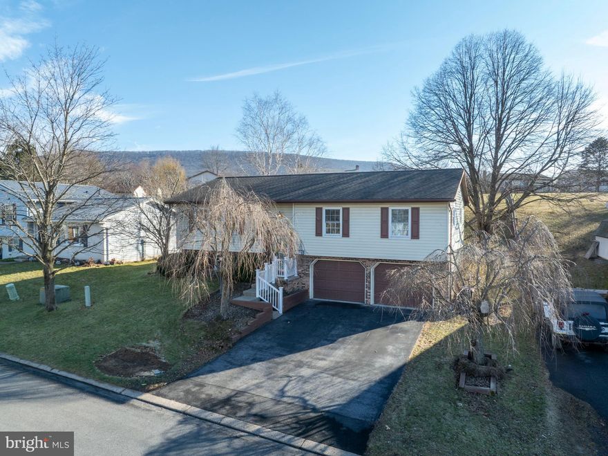 OPEN HOUSE - Sunday, Jan. 11th, 11:30 AM - 1:00 PM. Welcome home to this beautiful, move-in-ready property in Penn Hills, waiting for its new owner! This inviting home offers 3 bedrooms and 2 full baths and is packed with updates and thoughtful renovations throughout. The heart of the home is the fully remodeled kitchen and dining area, featuring newer appliances, quartz countertops, a convenient breakfast bar, tons of cabinet space and plenty of room for hosting family dinners and special gatherings. A pass-through window opens to the living room, creating an open, connected feel that is perfect for everyday living and entertaining. The living room is filled with natural light and offers generous space to relax.  The main level also includes a comfortable owner’s suite with a private full bath complete with a heated jetted tub and a stylish new vanity. Two additional bedrooms and another full bath round out the main level which also features newer LVP flooring throughout much of that level. The fully remodeled lower level adds even more living space, featuring new LVP flooring, fresh paint, updated lighting and more. The versatile finished area offers endless possibilities – family room, home office, gym, or playroom. The laundry area is also located on the lower level and provides ample space for storage and organization. Additional highlights include an attached two car garage and don’t miss the screened in back deck overlooking the back yard. With extensive updates throughout and flexible living areas, this Penn Hills home truly has it all – just unpack and enjoy!