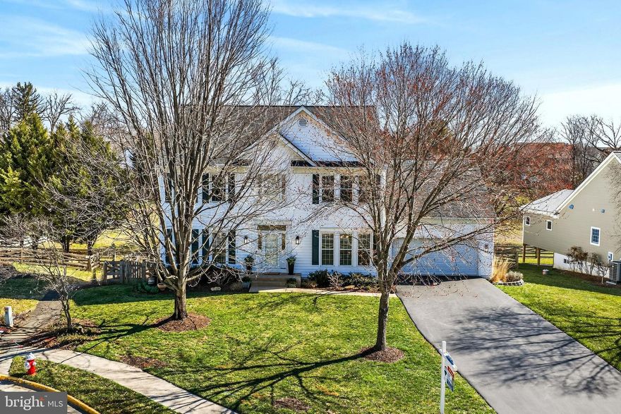 Your dream home awaits! 😍 Located on a peaceful cul-de-sac near the heart of Downtown Purcellville, this extraordinary residence exudes charm, elegance, and meticulous attention to detail. Pride of ownership is evident in every space and perfectly designed just for YOU!
<BR>
<BR>
Set on a picturesque lot backing to community-owned common area, this setting is magical. The flat, fenced yard is beautifully framed by flowering trees and vibrant seasonal plantings in both the front and rear, creating a private outdoor retreat. Enjoy relaxing or entertaining on the paver patio or expansive deck — ideal spaces for gathering with family and friends.
<br>
<br>
Inside, natural light pours through floor-to-ceiling windows, illuminating wide-plank hardwood floors that flow seamlessly throughout the main level and upper hallway and fresh, neutral paint enhances the bright, airy feel. At the HEART of the home, the inviting great room features a stunning stone fireplace and opens effortlessly to the morning room surrounded by three walls of windows, turning this space into a sunlit haven and offers direct access to the spacious deck with stairs to the patio. Back inside, the gourmet kitchen is designed to impress- showcasing gleaming granite countertops illuminated by under-cabinet lighting, high-end appliances, and an abundance of furniture-grade cabinetry. A conveniently located mudroom, found just off the kitchen, provides the perfect drop zone for daily living.
<br>
UPSTAIRS, you’ll find four generously sized bedrooms, including updated full baths, ceiling fans, plush carpeting, and hardwood flooring in the hallway.
<br>
The LOWER LEVEL-  offers incredible versatility with a spacious recreation room, dedicated craft or gaming area, fifth bedroom, and an updated third full bathroom — ideal for guests or multigenerational living. Storage is plentiful and includes built in wood shelving to help keep your treasures organized 🙏 The walk out condition offers easy access to the charming paver patio and grassy yard= PERFECT!!
<br>
<br>
**Garage Enthusiasts will LOVE this Expanded Space that includes a Workbench and Cabinets😍 [you're welcome!]
<br>
<br>
🏡UPDATES are plentiful and below are just a few-
<BR>
•2026-LG Dishwasher, Several Interior Rooms Freshly Painted   •2025- LG Washing Machine & Dryer, Outside Lighting & HVAC System     •2023- Lower Level Plush Carpeting,  Water Heater,  Sump Pump + Battery Back Up      •2021- LG French Door Refrigerator,  Humidifier     •2019- New Roof,  Deck Stairs & Tension Ties, Refreshed Upper Lvl Shared Bathroom
<br>
<br>
Located in the intimate Gardner Meadows community, residents enjoy low HOA dues focused on maintaining common grounds, maintenance of OT and safety fencing. Refuse collection and snow removal are provided by the Town of Purcellville, adding to the ease of everyday living.
<br>
❤️Get Ready to LOVE WHERE YOU LIVE❤️