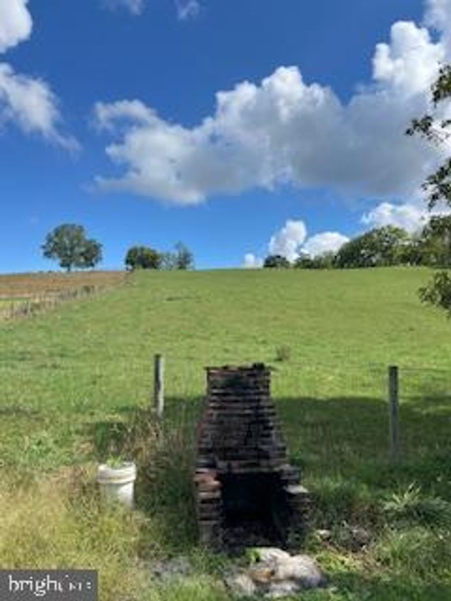 Hill top property in scenic location that offers privacy, yet is close to commuter routes and stores.