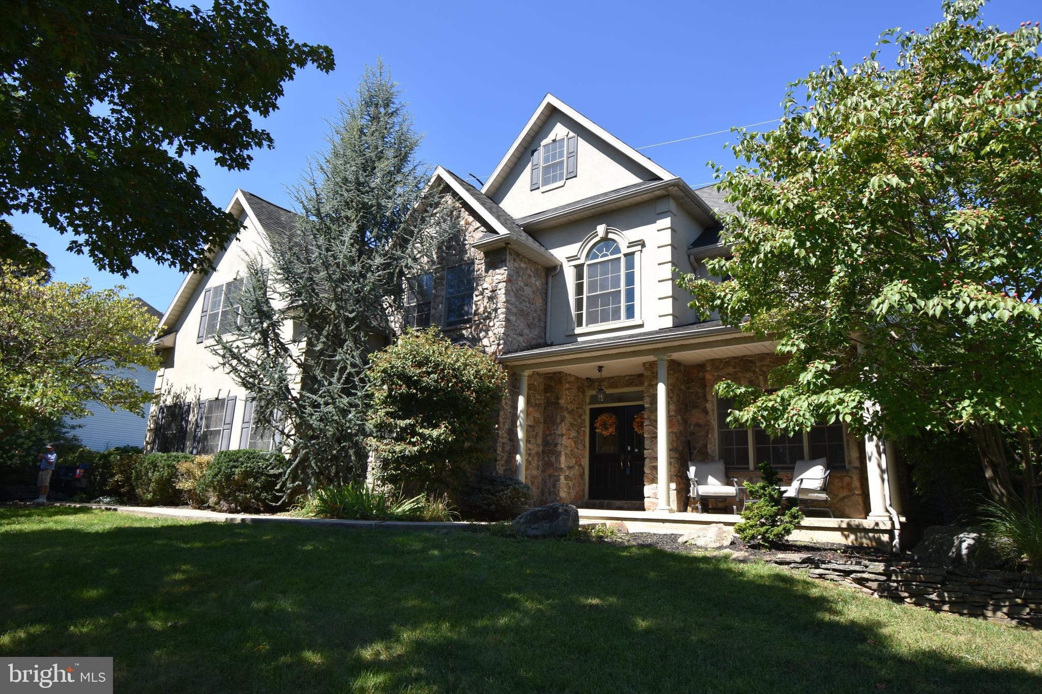 Stunning Home in Lower Saucon Township. Welcome to this exceptional residence in the prestigious Woodfields neighborhood ideally situated next to Lehigh University & Stabler Fields. From the moment enter the beautiful open entryway, you're greeted by a home that exudes elegance & comfort. The formal living & dining rooms are accented w/flanking columns, creating a sophisticated setting for entertaining. A private 1st fl office with glass French doors, a lighted tray ceiling, large windows, & a private 1/2 bath. The gourmet kitchen is a chef’s dream w/granite countertops, upgraded appliances, coffee/breakfast bar & countertop bar seating. A wall of glass offers views of the serene backyard w/tranquil waterfall, deck & patio. Retreat to the spacious master suite, which includes a sitting room w/a cozy gas fireplace, tray ceiling & large WIC. The luxurious master bathroom boasts a double vanity, large soaking tub, separate shower & private WC. The 2nd fl features 3 more bedrooms & 2 full bathrooms, along w/an open hallway overlooking the 2 story family room enhancing the home’s spacious & airy feel. Additional highlights include: 3 car attached garage, large corner lot w/professional landscaping, oversized driveway for ample guest parking, highly desirable location near parks, shopping & major commuter routes. Don’t miss this opportunity to own a beautifully appointed home in one of the Lehigh Valley's most sought-after communities. Public Open House: Saturday, September 13 from 1-3pm