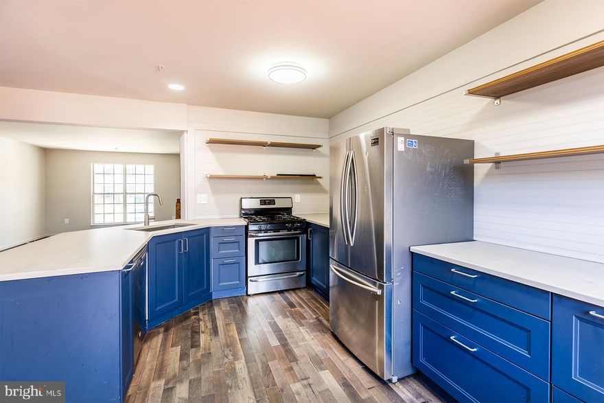 Price slashed for smart buyer in position for a quick closing. Three levels of great finished space featuring three bedrooms and two full and one half baths in this Odenton townhome across Fort Meade for an easy commute. New flooring, new paint, vanities, toilets and move-in ready.  Terrific front porch for lounging with a cup of coffee.  Just professionally painted interior in soothing decorator palette. Fun newer blue kitchen all open to breakfast nook.  New Anderson sliding door to a huge deck with stairs to a fenced yard. The seller will leave a screened-in deck gazebo for buyers.  The front foot assessment has just been paid off!  Fully finished walk-out basement with full bath and rec room that is wired for sound.  Full bath upstairs has dual entrance from owner suite and hallway. New quartz vanity area off walk-in closet in primary bedroom with two other baths upstairs. Cool new light fixtures too. Viviant Solar panels make for CHEAP BGE bills in today's outrage!  Solar paperwork in BRIGHT disclosures. The roof and HVAC have been replaced. All polybutelene piping has been replaced with copper piping too! All stainless steel appliances are also included.