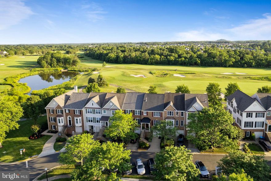 Welcome to this magnificent brick front townhome, perfectly situated on a highly coveted golf course lot within the sought after community of South Riding. With its picturesque setting and stunning features, this residence offers an unparalleled lifestyle for discerning homeowners. Boasting a single-car garage and backing to the lush fairways of the golf course, this home provides an idyllic retreat from the hustle and bustle of everyday life. As you step inside, you are greeted by gleaming hardwood floors that grace the main level. The open and bright floor plan allows for seamless flow between the living spaces, perfect for both relaxation and entertaining. The heart of this home is the exquisite kitchen, featuring a center island with a convenient breakfast bar, stainless steel appliances, gas cooking, and sleek corian countertops. Prepare culinary delights while enjoying the company of loved ones in the adjacent family room, which can also double as your Breakfast Room. Imagine sipping your morning coffee or enjoying an evening cocktail on the deck, with sweeping views of the South Riding Golf Course. The serene vistas provide a peaceful backdrop for outdoor gatherings and quiet moments of reflection. The upper level offers a sanctuary of comfort. The primary bedroom is a true retreat, boasting a spacious walk-in closet and a luxurious en suite bath. Pamper yourself in the soaking tub and enjoy the convenience of dual sink vanities. Two additional bedrooms and a full bath complete the upper level, providing ample space for family, guests, or a home office. The lower level of this townhome offers even more versatility and entertainment options. A cozy rec room awaits, featuring a gas fireplace that adds warmth and charm. The laundry room and garage access provide convenience, while the fenced backyard and lower-level deck offer additional outdoor spaces to relax and entertain. This exceptional property is ideally situated, with close proximity to pools, schools, shopping centers, cafes, restaurants, parks, sports fields/courts, walking/bike paths, Dulles South Rec Center, major commuter routes, Dulles International Airport, and so much more. Don't miss this opportunity to own a remarkable townhome that combines luxury, comfort, and a stunning golf course backdrop where you will experience the epitome of modern living in South Riding.