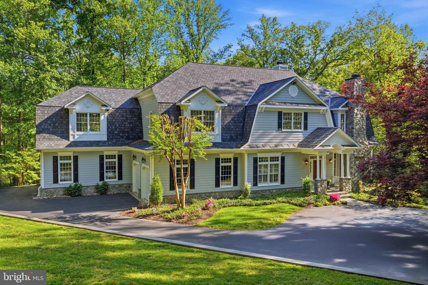 This exceptional custom residence offers the rare combination of timeless elegance, expansive living, and everyday convenience—just moments from Tysons, Reston, major commuter routes, and the area’s premier shopping, dining, business hubs and schools. Nestled on a beautifully landscaped, tree-framed 5 acre property, and set back down a long driveway off of Springvale Road, this property has the privacy and serenity Great Falls buyers seek, paired with the accessibility that today's luxury lifestyle demands.
A stately exterior, circular drive and striking architectural presence create an unforgettable first impression. Inside, a dramatic two-story foyer with sweeping staircase introduces sophisticated interiors designed for both grand entertaining and comfortable daily living. 10’ ceilings, gracious formal living and dining rooms, a handsome private office, elegant millwork, hardwood flooring, 2 powder rooms, and beautifully proportioned spaces define the main level.
At the heart of the home, the expansive chef’s kitchen is designed to impress—with a substantial center island with prep sink, Sub-Zero French door refrigerator, 48-inch professional-grade double oven gas range and hood, abundant cabinetry, butler’s pantry, walk-in pantry, and seamless connection to the sunlit breakfast area and spectacular great room. Here, soaring windows, built-in bookshelves, and a striking stone gas fireplace create a warm yet dramatic gathering space overlooking the lush backyard.  The newly added screened porch is a true extension of the home—offering peaceful, elevated outdoor living surrounded by mature greenery.
Upstairs, four generously sized bedrooms include a luxurious primary suite featuring a spa-like bath, steam shower and 2 oversized walk-in closets. Each of the other 3 spacious bedrooms have their own recently renovated full bathrooms and share an upstairs sitting area and back staircase.  Your clothes get first class treatment with a cedar closet, and an upper level deluxe laundry room, thoughtfully designed with folding space, shelving, and exceptional functionality.
The walk-out lower level offers remarkable flexibility with 9’ ceilings, a large recreation room with LVP flooring, workout space, guest bedroom, renovated full bath, and two cavernous insulated storage rooms. A sauna and beverage fridge convey.  This level is ideal for multigenerational living, guests, casual entertaining, and off-season storage.
4 attached garage bays were insulated and heated in 2022 with new garage doors. The attached garages all open into a rear mud room.  With two powder rooms on the main level, abundant storage, and dozens of closets, this home has an ideal floor plan that effortlessly balances elegance with livability.  The refined finishes and updates make this a rare Great Falls offering for buyers who desire luxury, privacy, and proximity without compromise.
Langley high school, Cooper Middle school and Colvin Run elementary school.
Roof 2020, 6” gutters 2020, 3 zones of HVAC: 2024, 2018 and heat pump 2024. Insulated garages, garage doors and garage heater 2022.  Whole house generator 2021, screened porch 2020, blinds and shutters 2022, laundry room 2020.  All upper bathrooms except primary were renovated in 2020.  10’ ceilings, hardwood floors on main level.