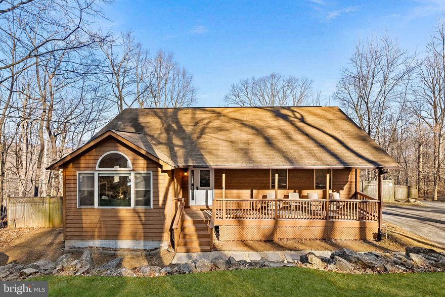 Welcome to 381 Windy Way! This 2,700 sq ft mountain retreat offers beautiful scenic views and a peaceful setting. Featuring 5 bedrooms and 3 bathrooms, this home has been recently renovated and is move-in ready for its new owner.

As you enter, you are greeted by hardwood floors, fresh paint, and vaulted ceilings, making the space feel open and inviting. The main level features an updated kitchen with new quartz countertops, a stylish backsplash, and stainless steel appliances. Two decks are accessible from the main level—one off the kitchen and another from the primary bedroom—perfect for entertaining or relaxing with your morning coffee or tea.

You will also find three bedrooms and two bathrooms on the main level. The primary bedroom offers a spacious en-suite bathroom with both a soaking tub and a separate shower.

Downstairs, the expansive walkout basement impresses with a large open recreation area, two additional bedrooms, and a den that can be used for multiple purposes.

Relax on the welcoming front porch, your fenced in backyard with mountain views,  or explore the natural beauty surrounding the home. High Knob offers a true sense of community with amenities including a clubhouse, pool, tennis courts, and direct access to the Appalachian Trail. High-speed internet is available.

High Knob is a sanitary district (not an HOA), and membership is required as part of property ownership. Dues are collected as a special tax and included in the semi-annual real estate tax bill. The High Knob water system obtains its source water from three springs and seven deep wells. The system is overseen by the Virginia Department of Health (VDH), which has previously recognized it as "one of the finest small water systems in the region." and has received multiple awards for excellence. 

Other Key Upgrades throughout include: new light fixtures throughout - 3 new bathroom fans, 3 new bathroom toilets - 3 new bathroom faucets - 3 new bathroom mirrors - 2 new bathroom vanity tops - new quartz kitchen countertops - new tile backsplash - new kitchen sink and faucet - new door handles and hinges throughout - new blinds throughout - 4 new ceiling fans - fresh paint - new front walkway - new carpet in basement. This home is truly move-in ready!

Schedule your showing today!