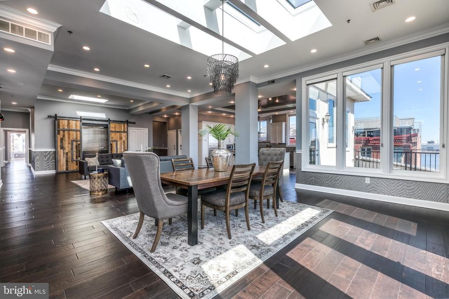 Incredible opportunity to enjoy the best of Old City and modern life. Stunning, sun-soaked, full floor penthouse with nearly 4300 square feet of wide open space. Single floor living and incredible river, bridge, and city views from exposures on all sides. This simply does not exist anywhere else in Center City anywhere near this price. 1600 sf of private outdoor space is yours, including a large main floor terrace off the living area and massive private roof deck with 360 degree panoramic views. An entertainer's dream on a massive scale. Elevator with private keyed access opens directly to the wide open living space with high ceilings, walls of glass,  fireplace, and wet bar. French doors open to the private terrace with river views. Massive open kitchen with huge island and seating boasts acres of cabinet space, Sub-Zero refrigeration, high end appliances, wine refrigerator, and stone counters. Spacious and luxurious master retreat with fireplace and dressing room/walk in closet. Fabulous new master bath with floating soaking tub and killer views, huge stall shower, custom vanity, water closet and more. 2 huge secondary bedrooms with incredible views and closet space share a jack and jill bath with dual vanities and frameless glass stall shower. The 4th bedroom/den/office is off the hall directly across from the powder room. Beautiful new suburban sized laundry room provides a mudroom with plenty of storage and direct elevator access when needed. Upstairs you'll find the incredible 850 sq ft roof deck, with 360 degree river, bridge, and city views. This unit is the entire top floor, sitting atop a boutique Stephen Girard warehouse rehab. Bonuses include spacious additional basement storage unit and 1 year seller paid parking across the street. Live well on a quiet cobblestone street north of Market, just steps from restaurants, boutiques, coffee shops, gyms, & galleries. Quick access to transit and highways.