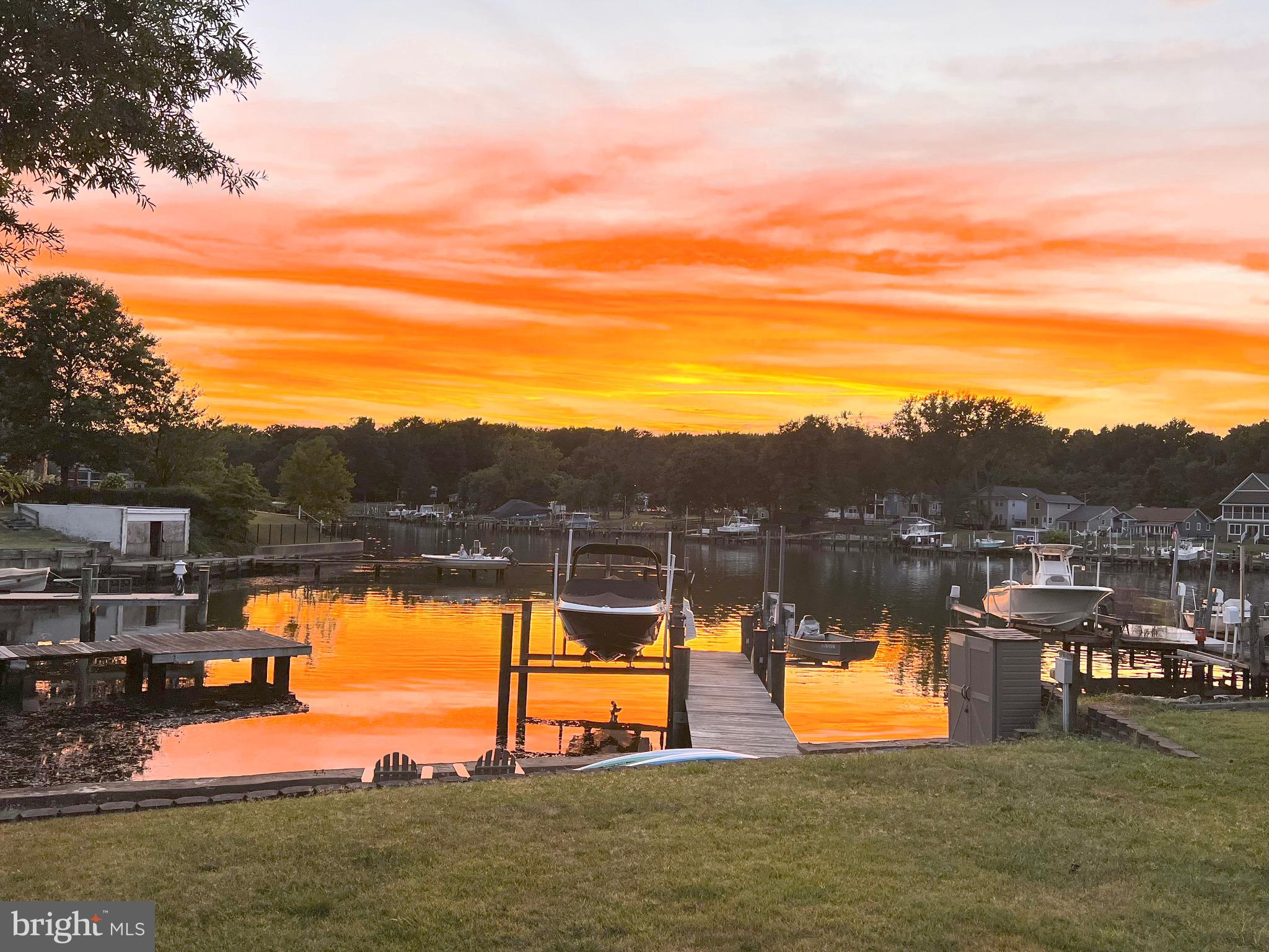 Bodkin Creek waterfront with elegant features throughout! Entertainers will love the open floor plan with great views of the river! Remodeled gourmet kitchen with 9ft ceilings, breakfast bar, stainless steel appliances, quartz countertops and gorgeous flooring. Spacious dining area and living room off the kitchen with walk out to large covered porch overlooking the river.
The upper level features 3 bedrooms and 2 full baths. The large primary suite with private bathroom, office space and covered porch with breathtaking views. Primary bathroom features walk in shower, large soaking tub and double vanity. Both bathrooms and laundry room were recently renovated.
Large backyard perfect for bbqs and gatherings with easy access to the private dock for your watercraft.
You’ll love the oversized two car detached garage that has 12 foot ceilings and 12’x 27’ storage room above.
Private dock with 1 boat lift (8000 pound rating) and 2 jet skit/small boat lifts (1000 pound rating each) included!
This neighborhood has direct entrance/access into the Downs Park! There are tons of trails, beaches, a dog park, pier, bands, festivals, and so much more just a hop, skip and a jump from this home!