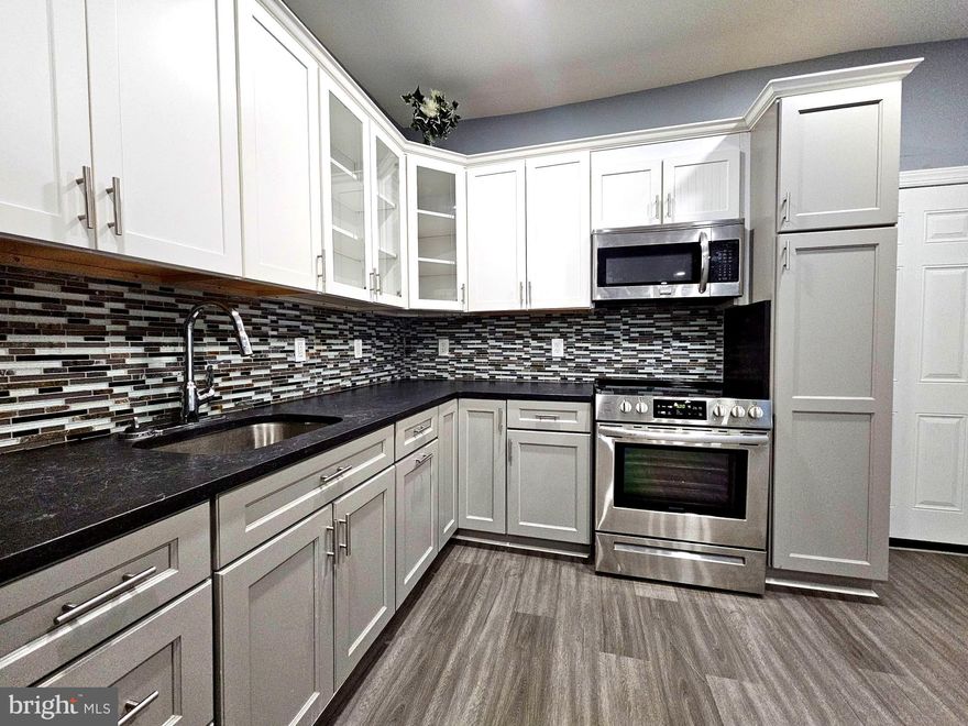 827 S 56th St is completely renovated 4-bedroom, 2.5-bath home in the Kingsessing neighborhood of Southwest Philadelphia. This stunning property features brand-new everything, including a modern kitchen with beautiful cabinetry, central air conditioning, and ample storage space. The full basement offers additional living space and a full bath, perfect for a guest suite or recreation room. Enjoy outdoor living on the rear deck. With thoughtful updates throughout, this home is move-in ready and ideal for comfortable family living.