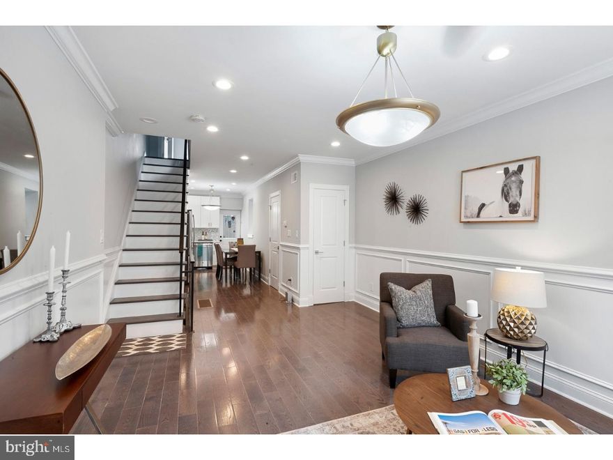 Newly fully renovated modern 2 bedroom  3rd bedroom or office in basement 2.5 bathroom home, build with care by a very experienced developer, in the highly sought-after South Philly, surrounded by new development. You walk into a beautiful open floor plan with hardwood  floors and recessed lighting throughout. First floor features bright living area with a modern kitchen and  granite counter tops, gas stove and stainless steel appliances. Rear private fenced in patio with plenty of room for a grill and patio table for warm nights. On the second level you have 2 nice sized bedrooms with a full bath, a roman tub and shower. The finished basement could be used as a 3rd bedroom with a full bathroom with huge space with lots of storage. One Year builders warranty included.