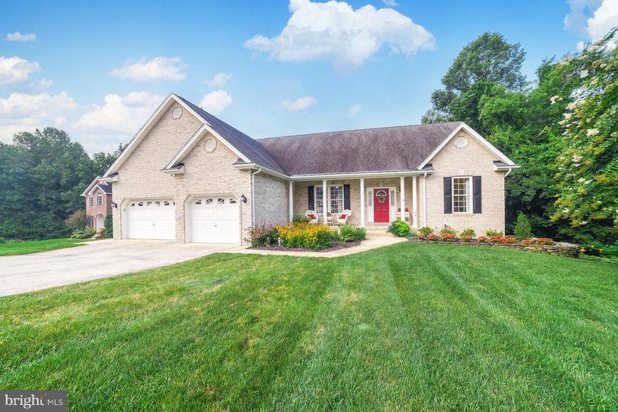 Fall in love with this meticulously maintained brick front rambler at end of cul de sac in sought after Huntingtown! 2000 sq ft ABOVE GRADE...Open concept floor plan...split l bedroom design. Main level great room with gas fireplace, cathedral ceilings, and Brazilian cherry hardwood floors. Kitchen boasts 42" natural maple cabinets, built in microwave, side by side refrigerator, and a kitchen nook w/ slider leading to composite deck overlooking the most gorgeous backyard! Plenty of room for an in ground pool! Full laundry room off the kitchen. Finished basement includes wet bar, full bathroom, rec room, room for two additional bedrooms, and tons of storage....perfect for entertaining. Additional features include generator, irrigation system, water conditioner, over-sized 2 car garage. Better run, you don't want to miss this one!