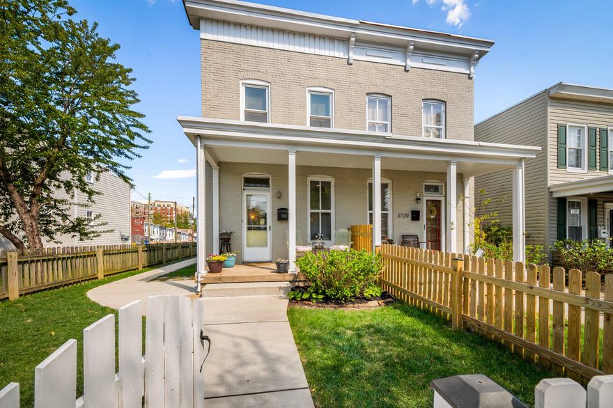 Rarely available, fully renovated semi-detached home in a prime Hampden location, offers the perfect blend of classic charm and modern updates. Thoughtfully redesigned throughout, this bright and sunny residence features three bedrooms and two full baths, with an easy, flowing layout ideal for both everyday living and entertaining.

Natural light pours in from multiple exposures, highlighting beautiful hardwood floors and warm touches of exposed brick that add character and style. The spacious gourmet kitchen is the heart of the home, offering generous prep space, ample storage, and a layout designed for both cooking and gathering. Enjoy morning coffee on the welcoming front porch or unwind on the rear deck overlooking a fully fenced yard—perfect for entertaining, pets, or creating your own outdoor garden retreat.

Upstairs, the bedrooms offer comfortable, light-filled spaces with flexibility for guests, a home office, or additional living space. The third bedroom is currently configured as a combined laundry, dressing, and workspace. For those who prefer a more traditional layout, washer and dryer hookups are already in place in the main-level mudroom closet, allowing for an easy transition back to a dedicated third bedroom.

Another standout feature is the rare two-car garage—an exceptional convenience for the neighborhood—providing both parking and additional storage.

Ideally situated in Hampden between The Avenue and The Rotunda, this home provides effortless access to local shops, dining, and daily conveniences—offering the best of city living with a welcoming neighborhood feel.