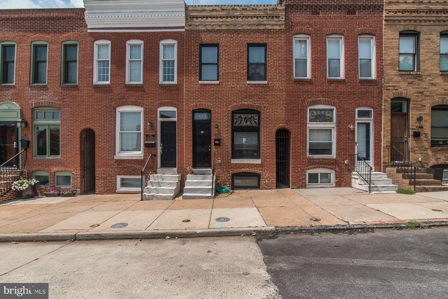 Shows like a model! This bright & beautiful Canton home is a 2015 full reno. *7.5 YRS remaining on CHAP TAX CREDIT!* Stunning Kit feat Quartz counters, geometric bksplsh & ss applcs. Hrdwd flrs on Main & Upper lvls. Each BR has its own Bath! Impressive finishes incld coffered & tray ceilings, designer color scheme & custom tile work. Roof deck w/ views of water & Mr. Boh; Prkg pad for compact car.