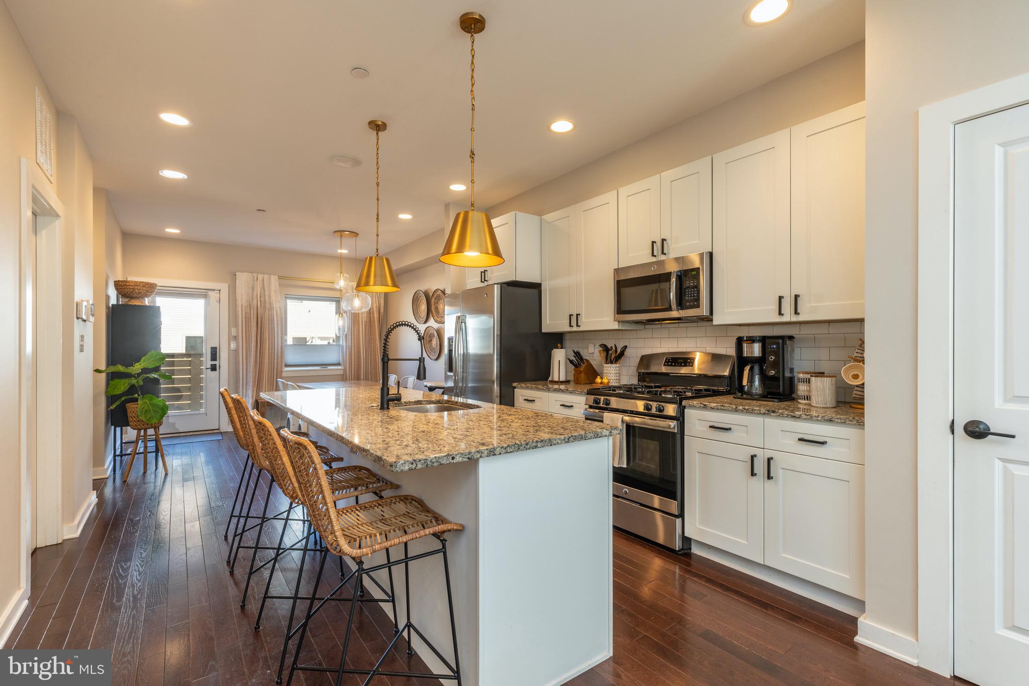 Stunning 3B/2.5BA townhome with PRIVATE PARKING in the booming East Kensington/Fishtown area with a 10 year tax abatement and 4 years left! 

On the main floor you'll find a sun-drenched open kitchen/dining/living combo floor plan with a pantry and half bath. The kitchen features a huge island/breakfast bar, stainless steel appliances white shaker cabinets with black cabinet handles and granite countertops. Out the backdoor you will find a fenced in yard perfect for your furry friends along with a private parking spot! The drive isle comes in on Boston street. The huge fully finished basement nearly doubles your living space and can be used as an extra TV room, playroom, home gym, or home office. 

Head upstairs to two spacious bedrooms, a shared full bath with tub/shower combo, a full laundry room, and outdoor balcony. 

The third floor is a primary suite with walk in closet and primary bathroom with a dual vanity and glass shower. Exit to your private roof deck with spiral stairs leading up to a second deck perfect for watching an evening sunset or entertaining guests with unobstructed views!

Only three blocks from the York-Dauphin El SEPTA station and quick access to 95. Take a walk to tons of awesome cafes & restaurants like Pizza Brain, Tired Hands Brewing, Martha, Suraya, La Colombe, Green Eggs Cafe, Memphis Taproom, Loco Pez and much more.